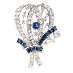 8.22 Carat Diamond Sapphire Platinum Flower Brooch, circa 1940s