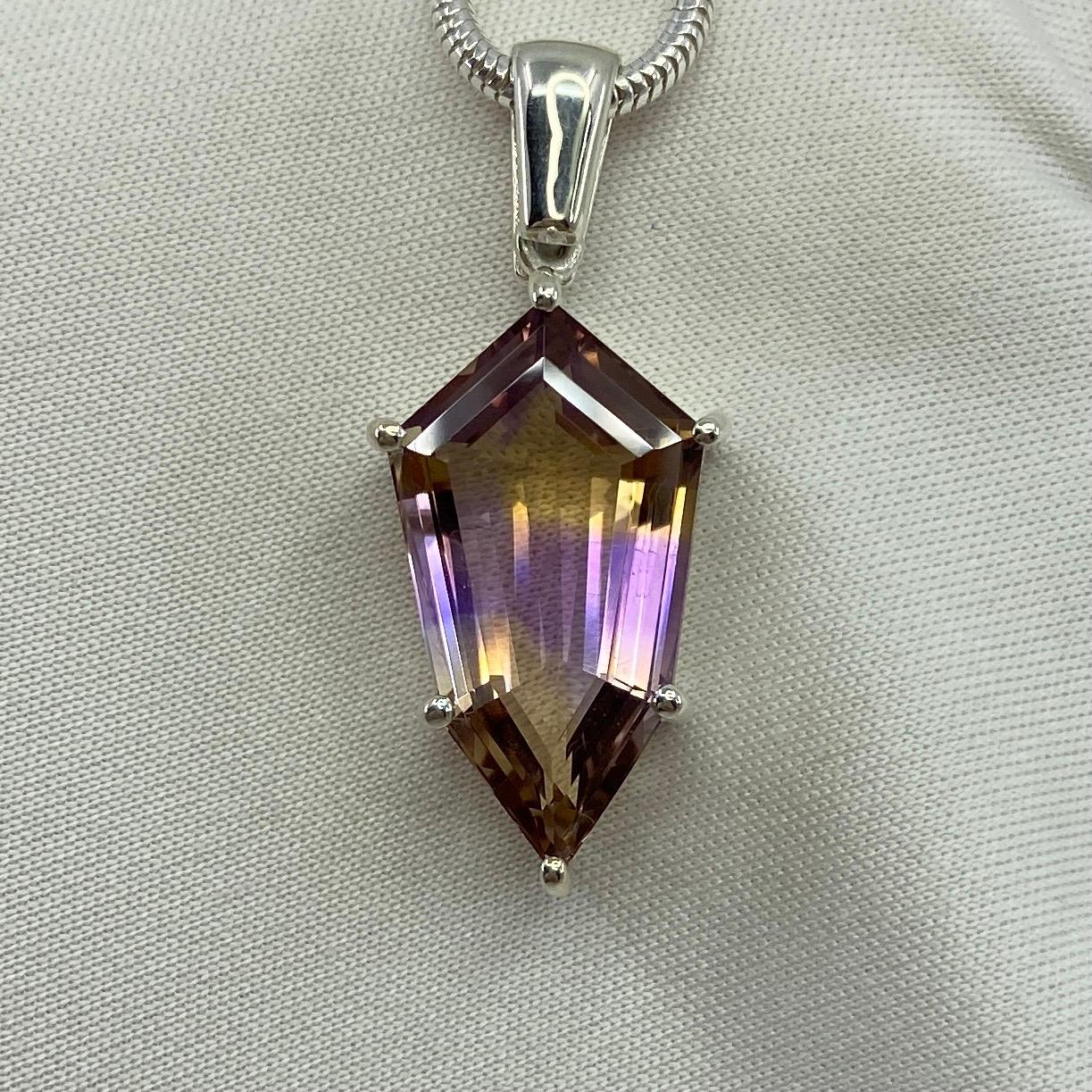 Natural Ametrine Shield Cut Silver Pendant Necklace.

Beautiful 8.23 carat ametrine with stunning yellow and purple colour zoning. Set in a bespoke 925 sterling silver solitaire pendant setting.
Stunning ametrine with beautiful colour and excellent