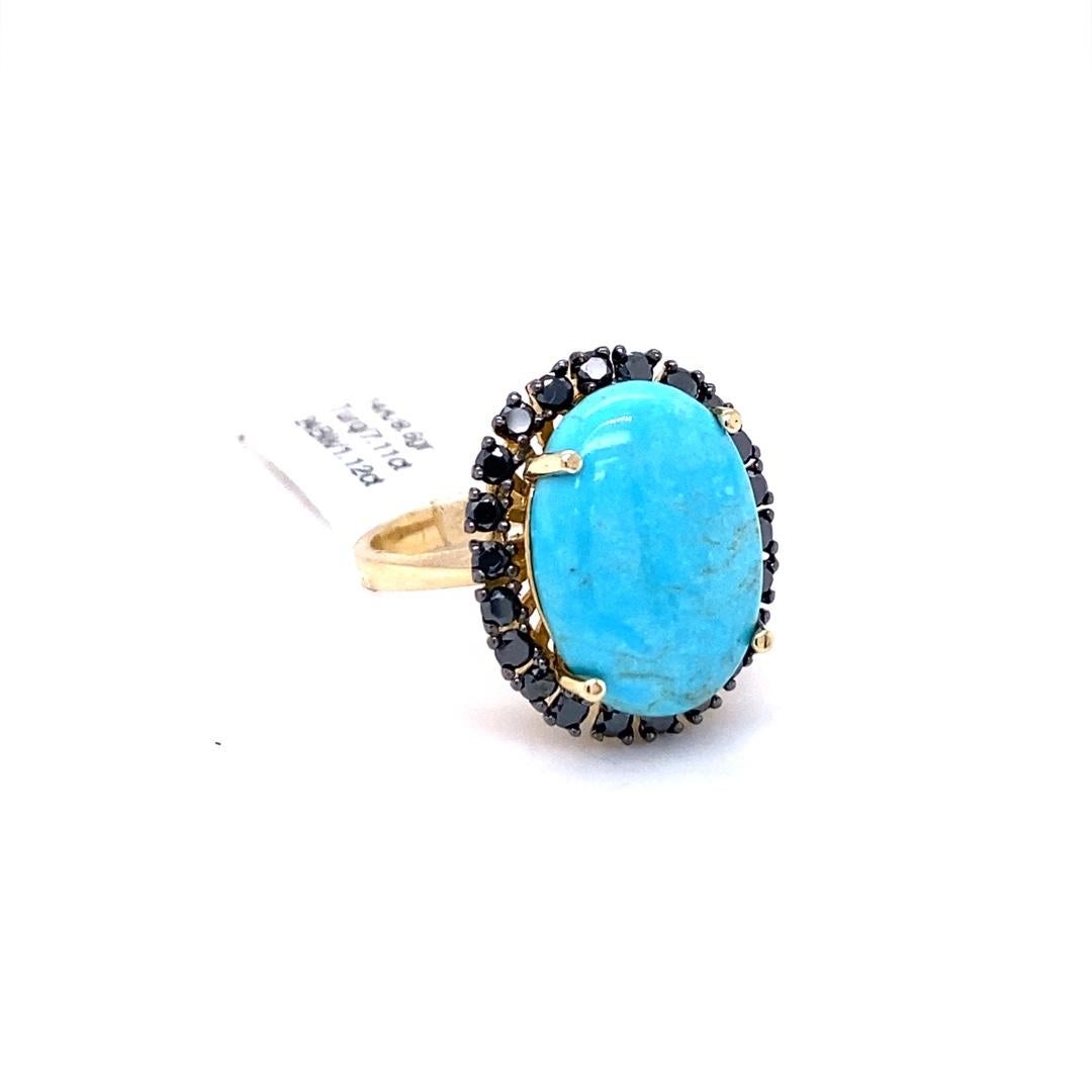 This ring has a 7.11 Carat Oval Cut Turquoise and is surrounded by 24 Black Round Cut Diamonds that weigh 1.12 Carats. The total carat weight of the ring is 8.23 Carats. The turquoise measurements are approximately 14 mm x 19 mm.

The ring is