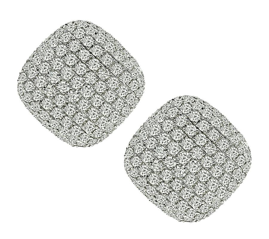 This is an amazing pair of 14k white gold earrings. The earrings feature sparkling round cut diamonds that weigh approximately 8.23ct. The color of these diamonds is G-H with VS clarity. The earrings measure 26mm by 26mm and weigh 13.8 grams. The