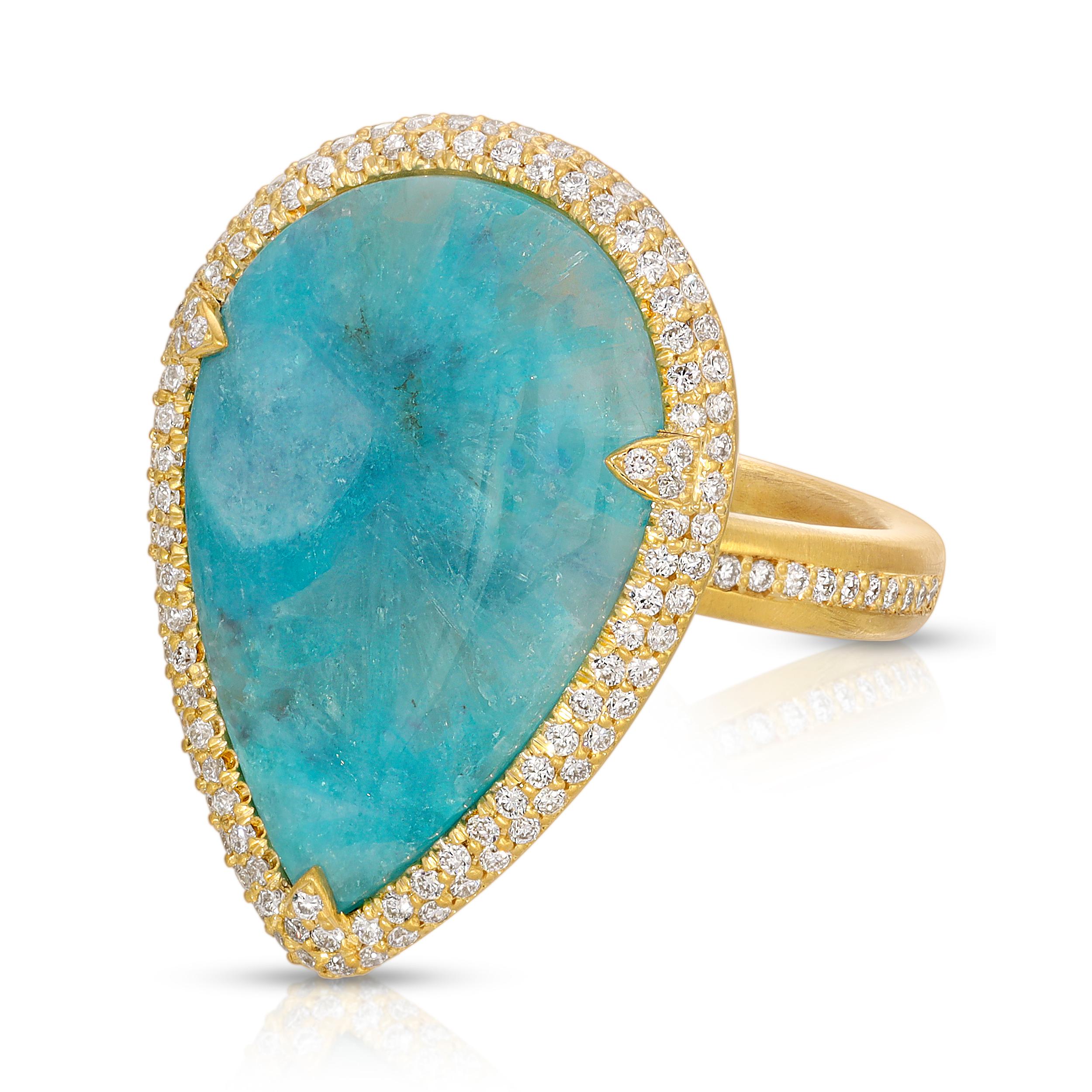 This special 8.24ct Milky Brazilian Paraiba comes from only one mine in Brazil and is very unusual as typical Paraiba is clear blue. The life and character of these Milky stones truly makes them one of a kind. It is set in 18k Matte Gold with a
