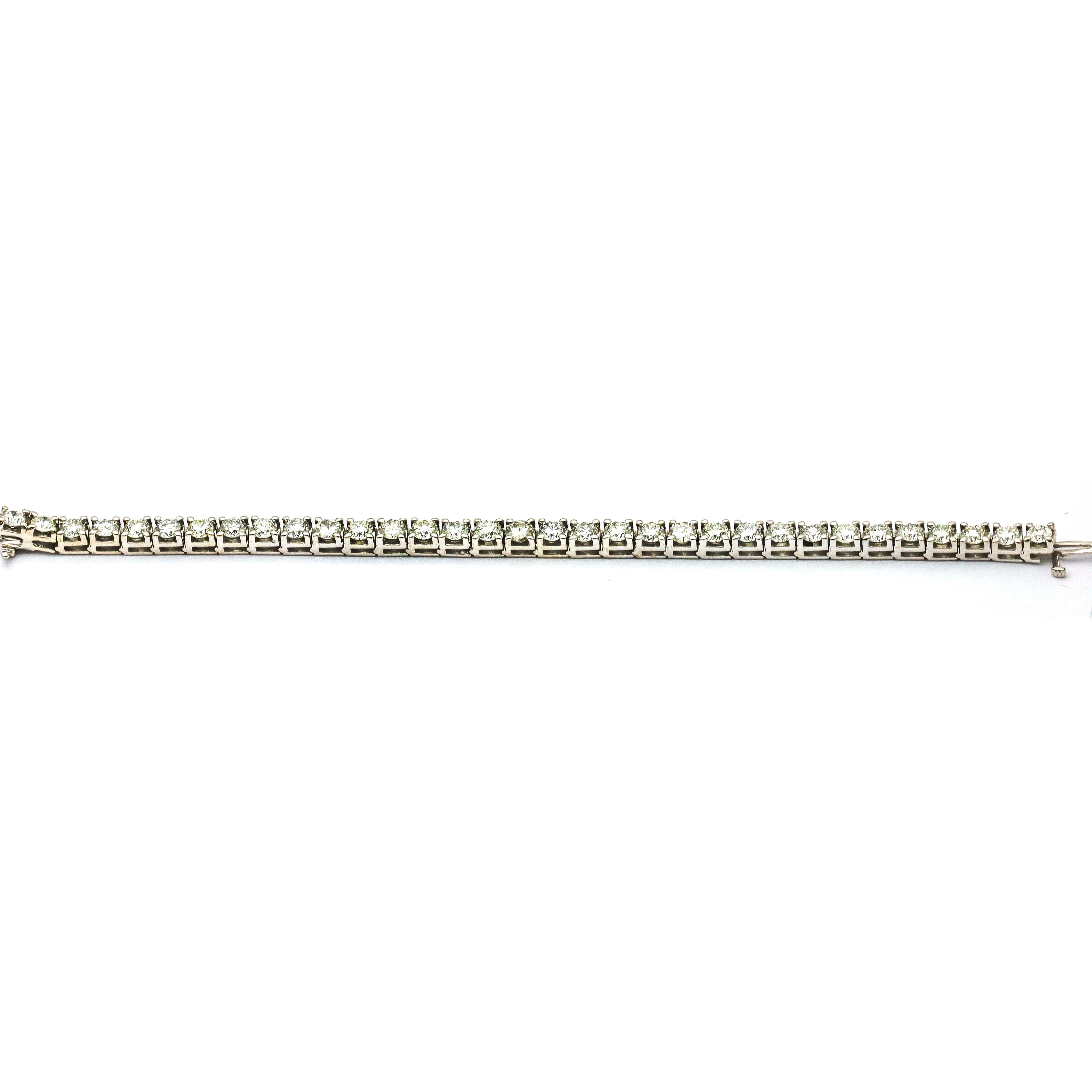 Classic diamond tennis bracelet crafted in 18k white gold. Size medium, fits a wrist up to 6 inches. The bracelet is prong set with 33 round-cut natural diamonds. Each diamond weights .25 carat. Diamond total carat weight, 8.25 carats. H-I Color.