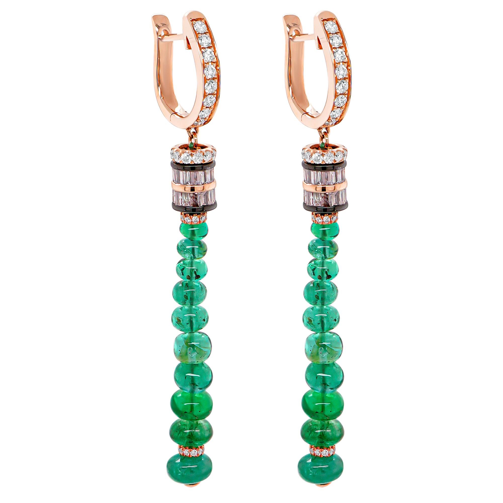 These breathtaking 18K gold chandelier earrings are a true masterpiece of elegance and luxury, featuring a stunning combination of 8.25 carats of vivid emeralds and dazzling white diamonds. Designed to captivate, these earrings exude timeless