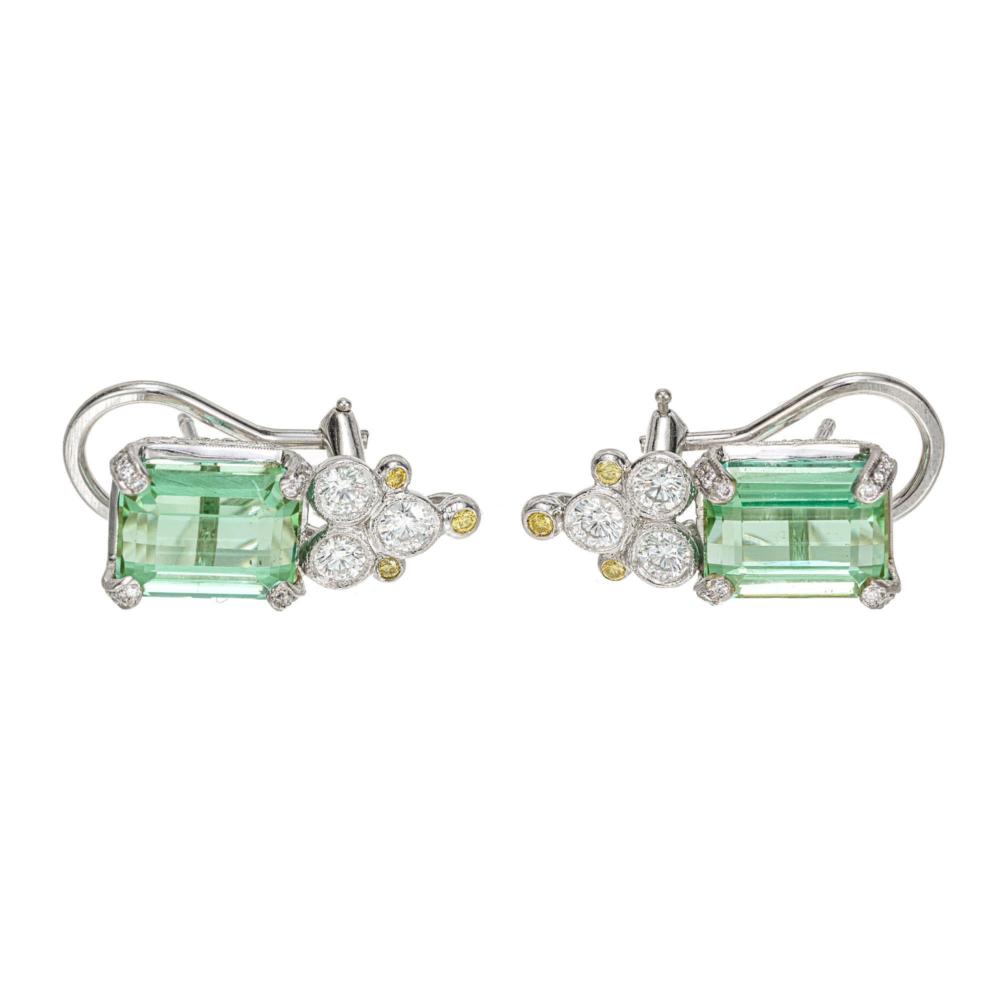 Art Deco handmade Platinum micro pave diamond and green tourmaline clip post earrings. 2 green emerald cut tourmalines set in platinum baskets with 96 round accent diamonds, 6 fancy yellow and white bezel set accent diamonds. GIA Certified bluish