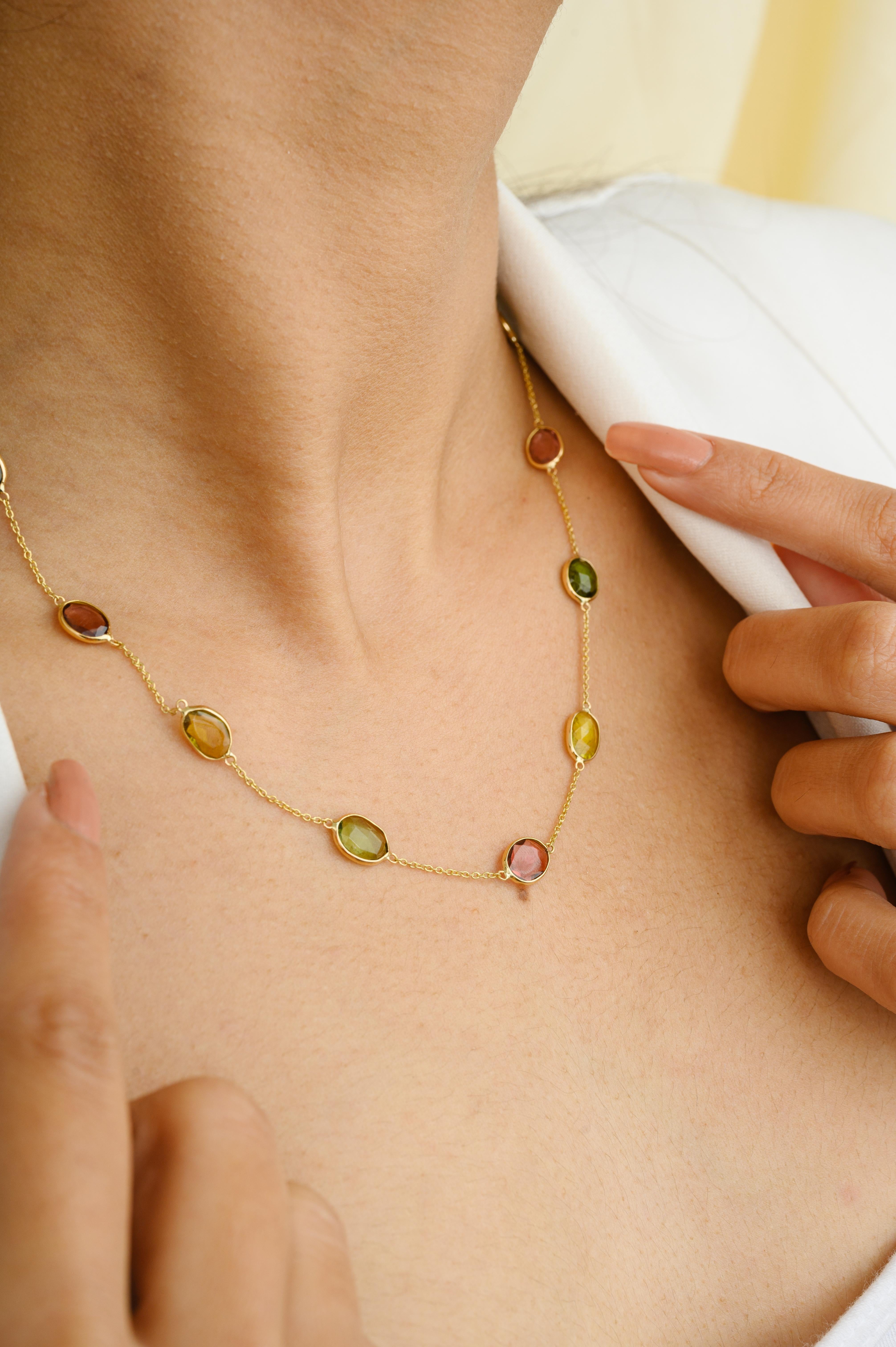 8.25 Carat Natural Tourmaline Station Chain Necklace in 18K Gold studded with uneven cut tourmaline. This stunning piece of jewelry instantly elevates a casual look or dressy outfit. 
Tourmaline creates a shield and prevents negative energies from