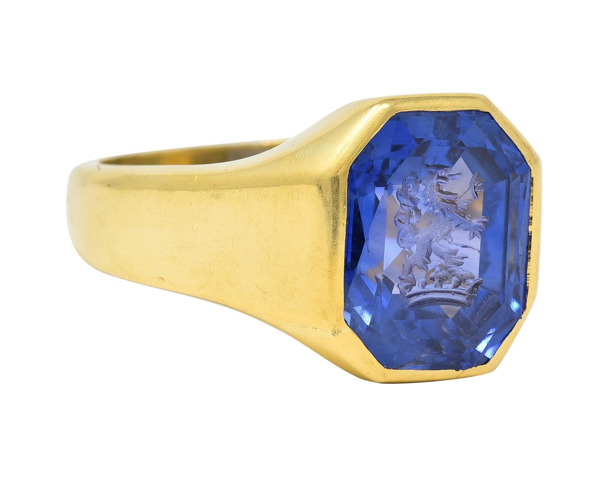 Centering an octagonal mixed-cut sapphire weighing 2.86 carats - transparent blue in color
Natural Sri Lankan in origin with no indications of heat treatment
Carved with an intaglio of a heraldic lion and crown
Bezel set with a contoured gold