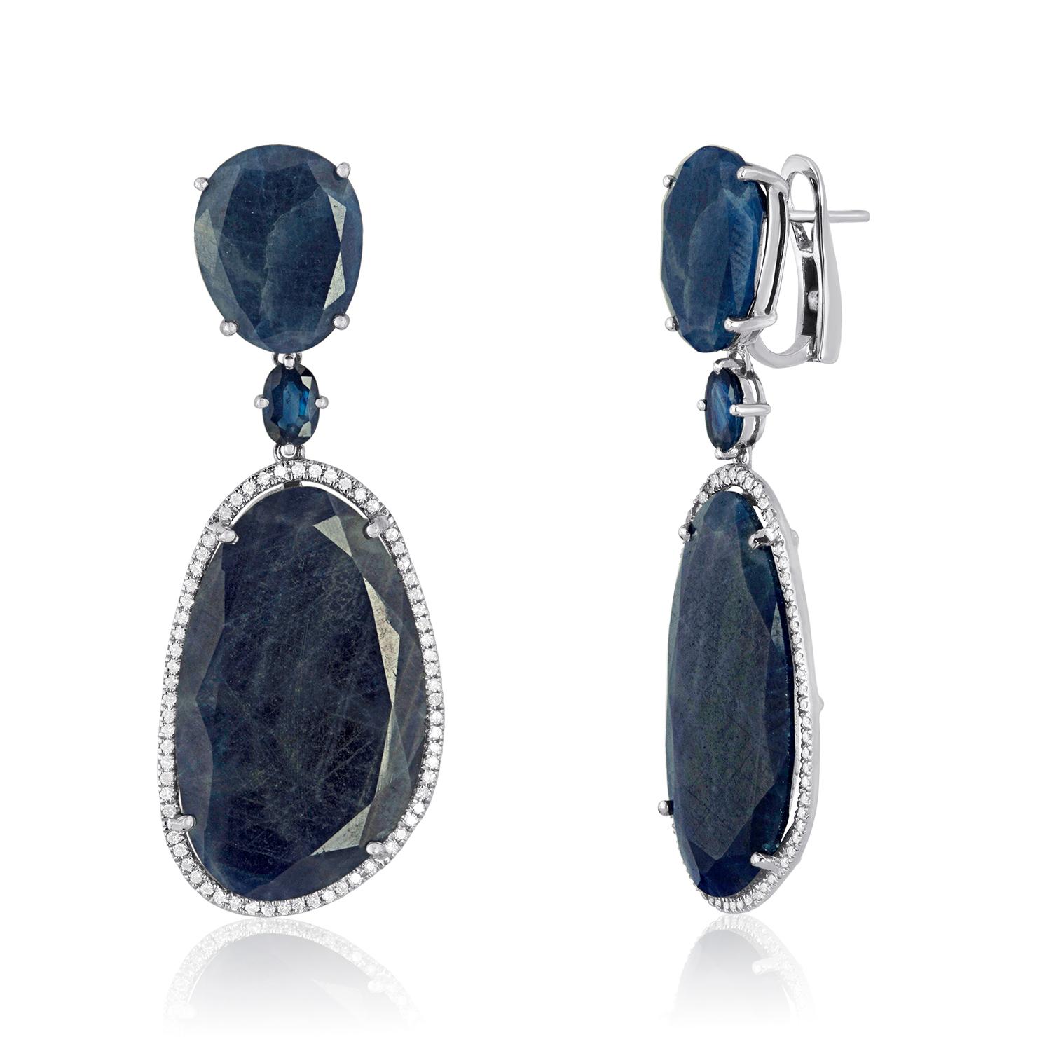 Sliced Sapphire Drop Earrings set in 14K White Gold surrounded by Diamonds 
Please note that there will be slight variations in each stone as all sapphire slices are natural.
82.61ct Natural Sapphires
0.54ct Diamonds
They measure 2