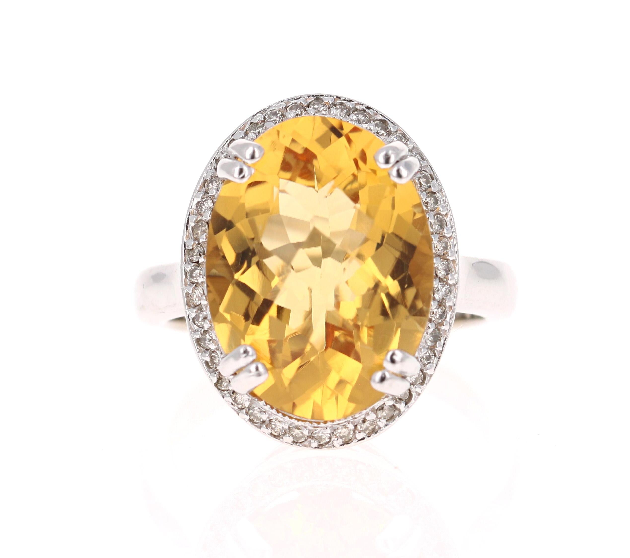 This beautiful ring has a bright and large Citrine that weighs 8.07 Carats. It is surrounded by a Halo of 40 Round Cut Diamonds that weigh 0.80 carats (Clarity: VS, Color: H). The total carat weight of the ring is 8.27 Carats. 

The Oval cut Citrine