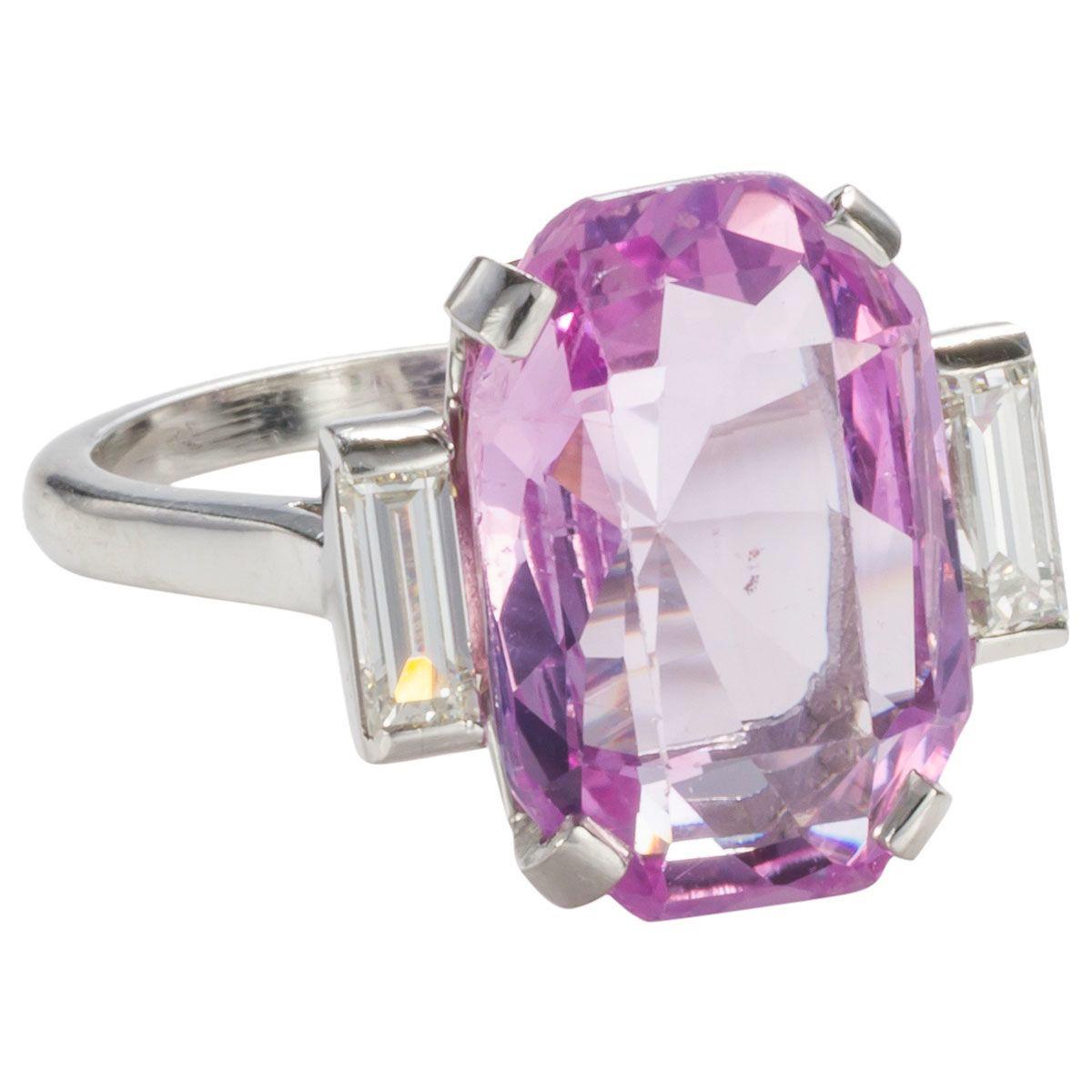 Pretty in pink - this is truly a pink lovers ring. Showcasing the most magnificent 8.27ct unheated SSEF (Swiss Gemmological Institute) Ceylonese pink sapphire cut in the most perfect proportions of a modified Octagonal Step cut. Simple and