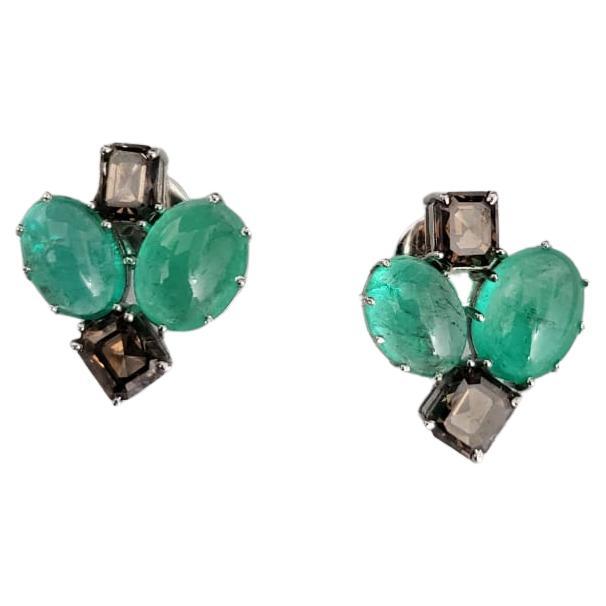 A very gorgeous and beautiful Emerald Stud Earrings set in 18K White Gold & Diamonds. The weight of the Emeralds is 8.27 carats. The Emeralds are completely natural, without any treatment and is of Columbian origin. The weight of the Diamonds is