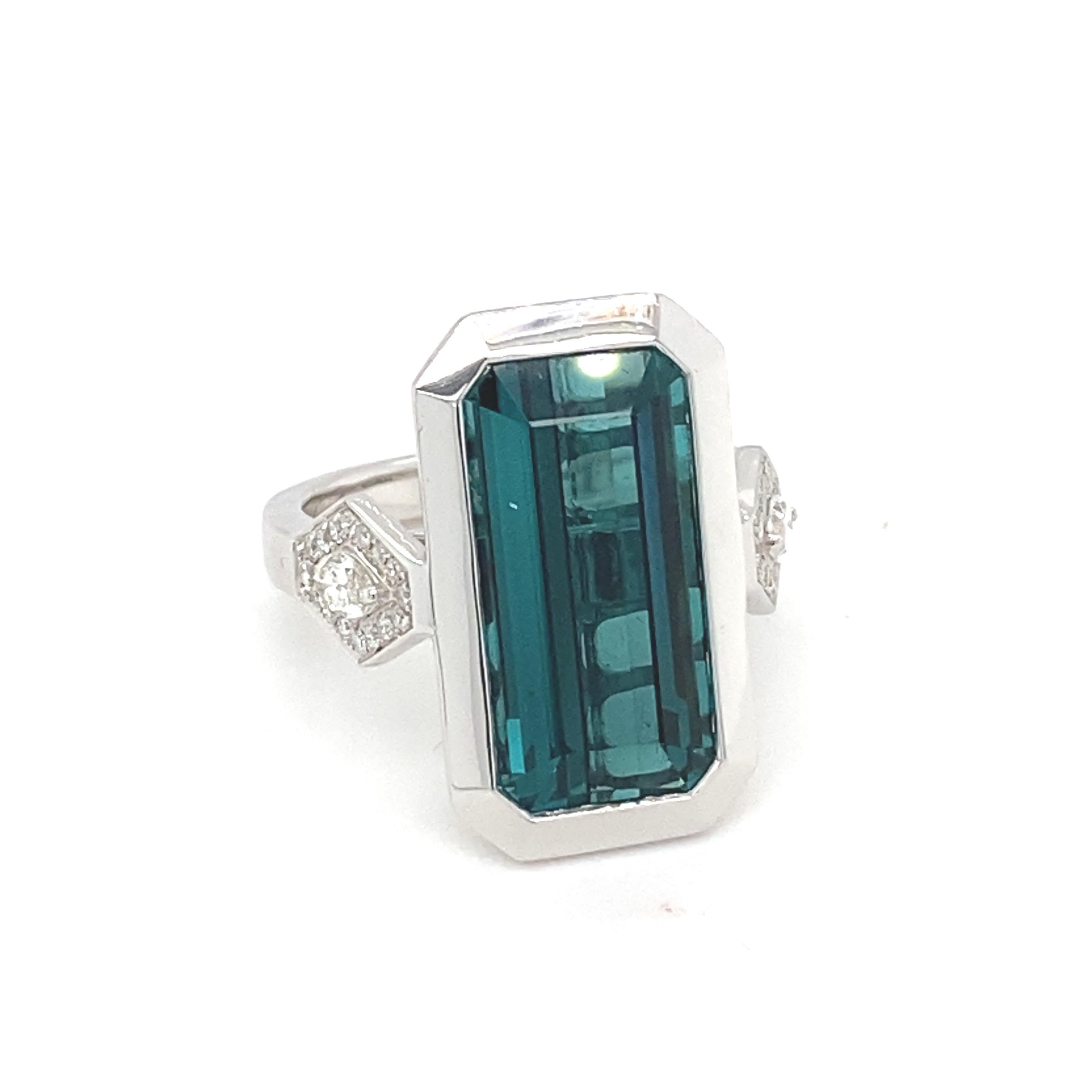 This baguette indicolite tourmaline has bezel setting in white gold. East west has accent diamond. Carefully crafted with skilled artisan this ring design marries elegance and modernity.
Indicolite Tourmaline: 8.28 carat
Diamond: 0.41 carat
Gold: