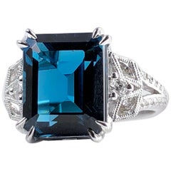 8.28 Carat Emerald Cut Vivid Blue Topaz Ring in 14 Karat White Gold