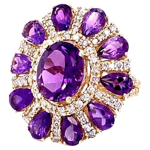 8.28 Carat Natural Amethyst and Diamond Yellow Gold Cocktail Ring

**This ring has our heart** Truly one-of-a-kind color and beyond stunning in person!

Ring Specs:

Natural Amethyst  (Oval Cut) = 3.28 carats
10 Natural Amethysts (Pear Cut) = 3.28