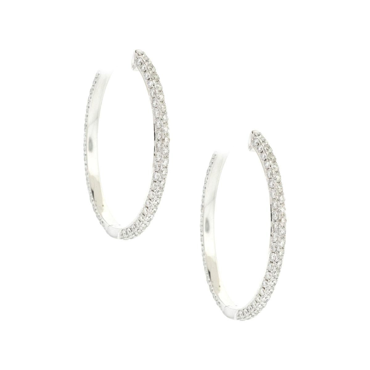 18k White Gold 8.29ctw Diamond Pave Oval Hoop Earrings

Company: Unbranded

Style of jewelry: Diamond Pave hoop earrings

Material: 18k white gold

Stones: Approximately 8.29ctw of round cut Diamonds. They are approximately G/H in color and VS/SI in