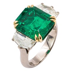 green carat 8.29 Carat White and Yellow Gold Three-Stone Green Emerald and Diamond Ring