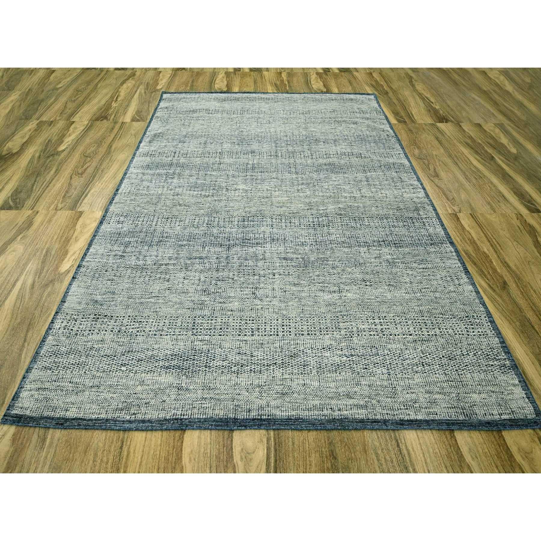Astros Navy Blue, Oxidized and Distressed Grass Design with Exposed Warps, Pure Wool, Hand Knotted, Oriental Rug
Primary materials: Wool
Latex: No Pile 
height: 0.25 Inches
Style: Contemporary
Primary color: Blue
Secondary colors: Ivory
Pattern: