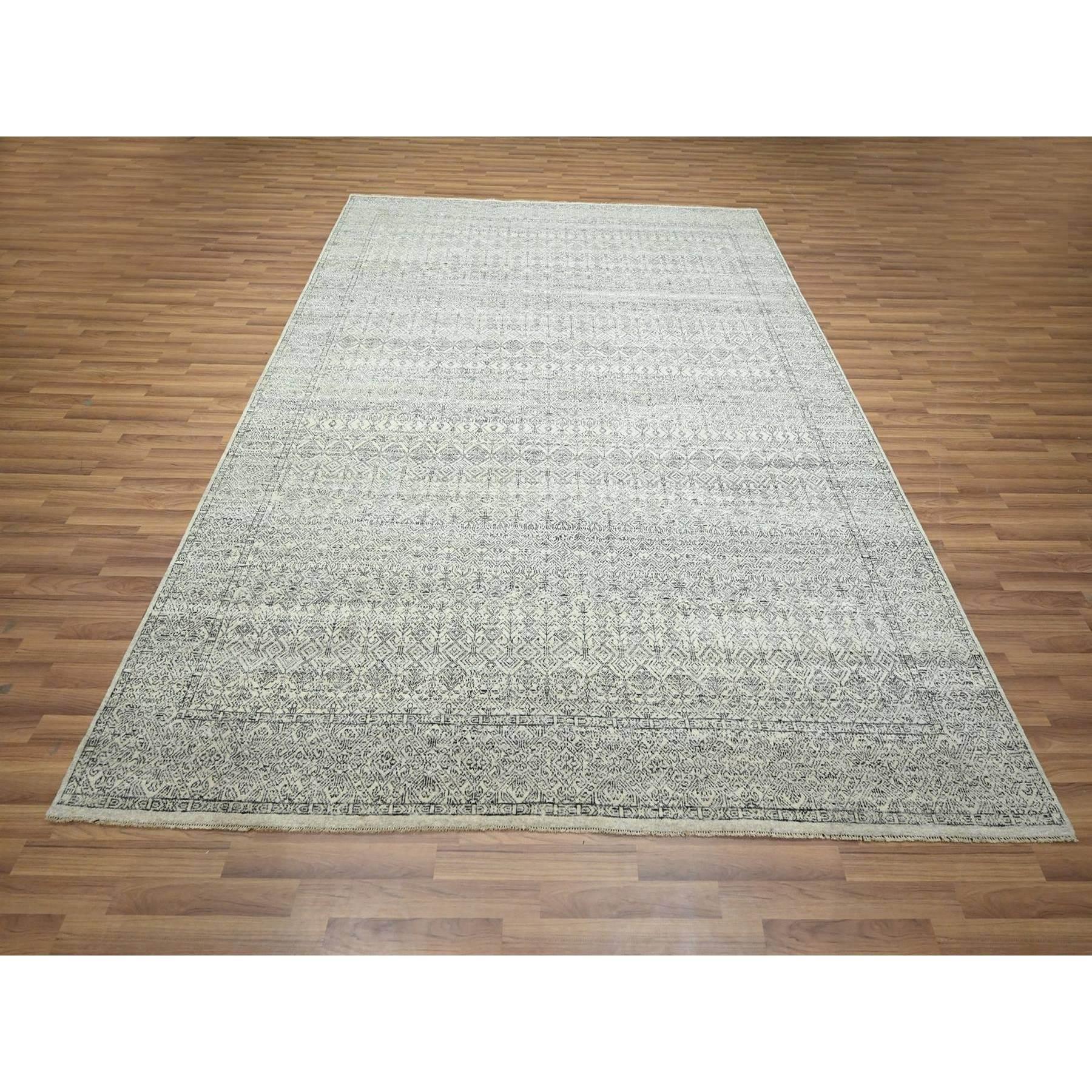 Chiffon White, Repetitive Geometric and Intricate Tree Design, Undyed Natural Wool, Hand Knotted, Oriental Rug
Primary materials: Wool
Latex: No Pile 
height: 0.25 Inches
Style: Transitional
Primary color: Ivory
Secondary colors: Gray
Pattern:
