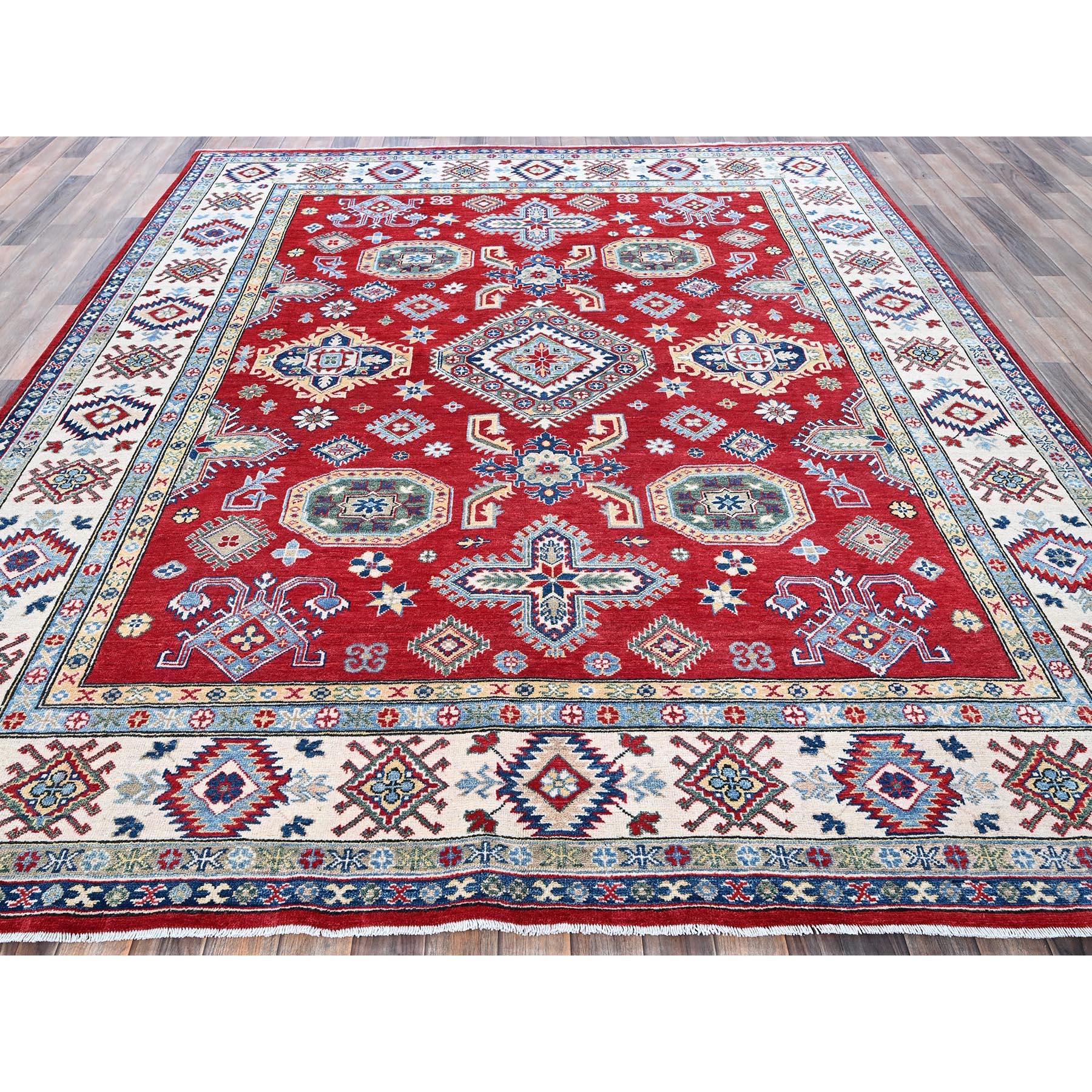 Crimson Red, Kazak with Geometric Medallions Design, Denser Weave, Soft and Velvety Wool, Hand Knotted, Vegetable Dyes, Oriental Rug
Primary materials: Wool
Latex: No Pile 
height: 0.25 Inches
Style: Traditional
Primary color: Red
Secondary colors: