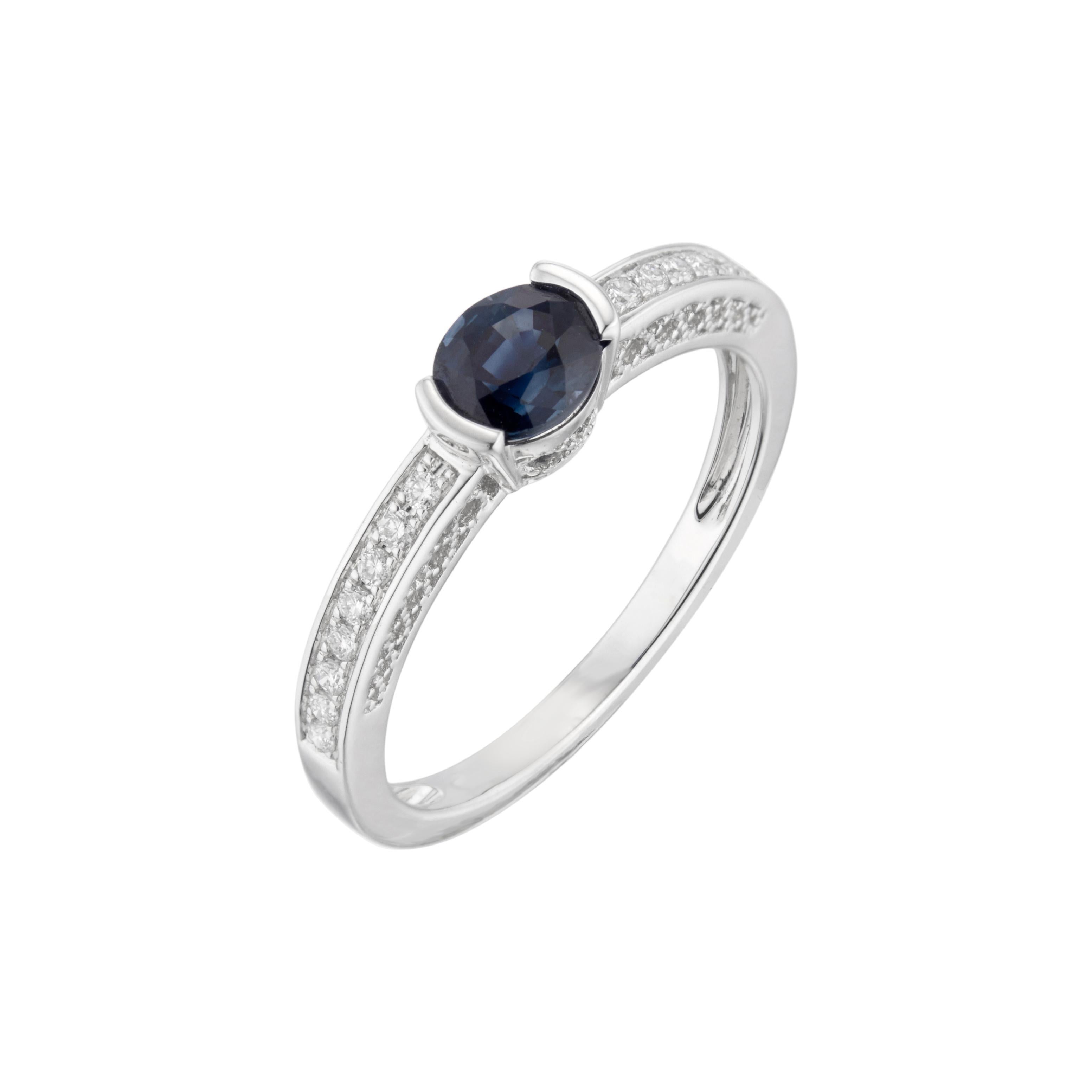 Sapphire and diamond engagement ring. Side set oval center sapphire set in a 14k white gold setting with 16 diamonds along both sides of the shank. 

1 oval blue sapphire, approx. .83cts
16 diamonds, G VS-SI approx. .12cts
Size 7 and sizable
14k