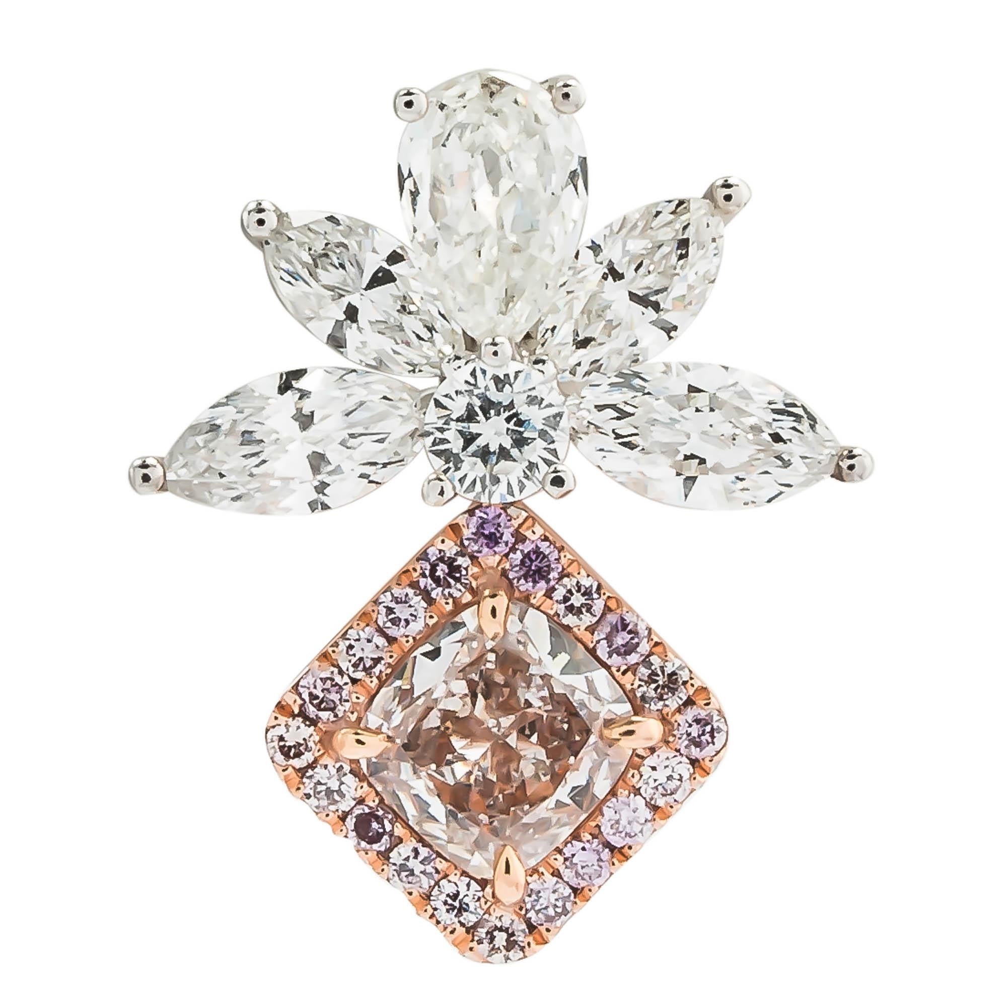 18 karat two tone earrings featuring two pink cushion cut diamonds with a total weight of .83 carats, framed in a rose gold setting with full cut pink diamonds with a total weight of .29 carats, set with marquis and pear shaped diamonds with a total