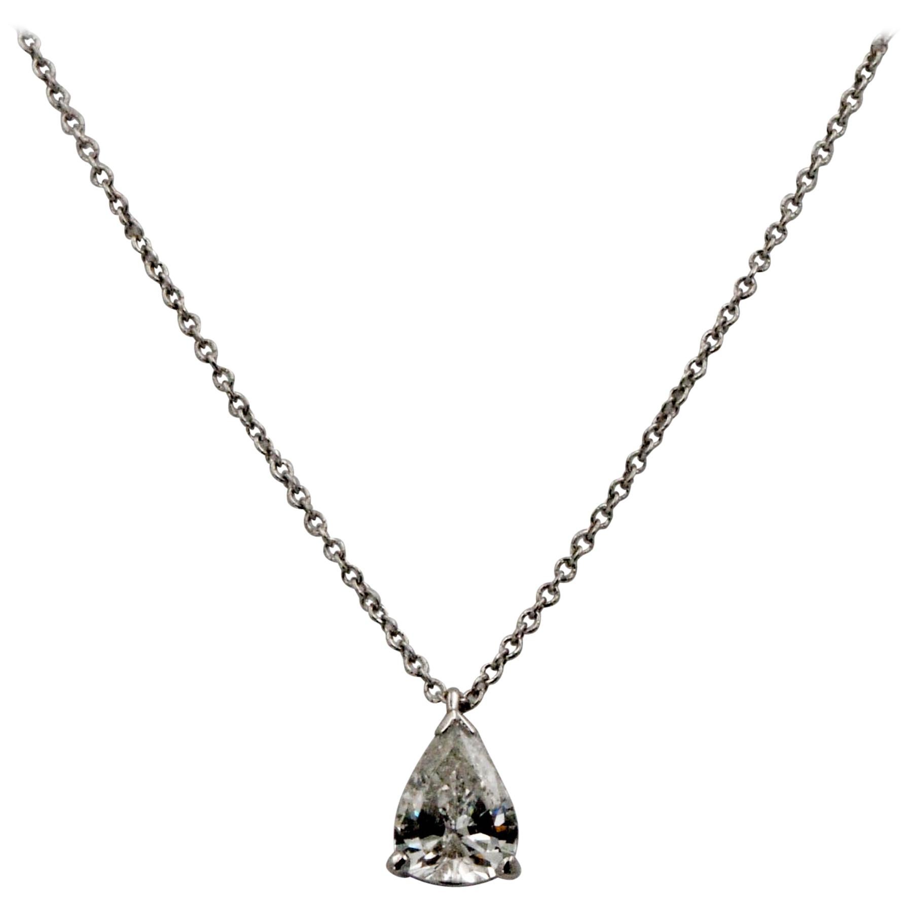 A stunningly simple Vintage Pear shape pendant hangs on a sublime platinum chain. 0.83 carat vintage pear shape transition cut H color I1 internal clarity, no certificate. 18 inch platinum chain. 