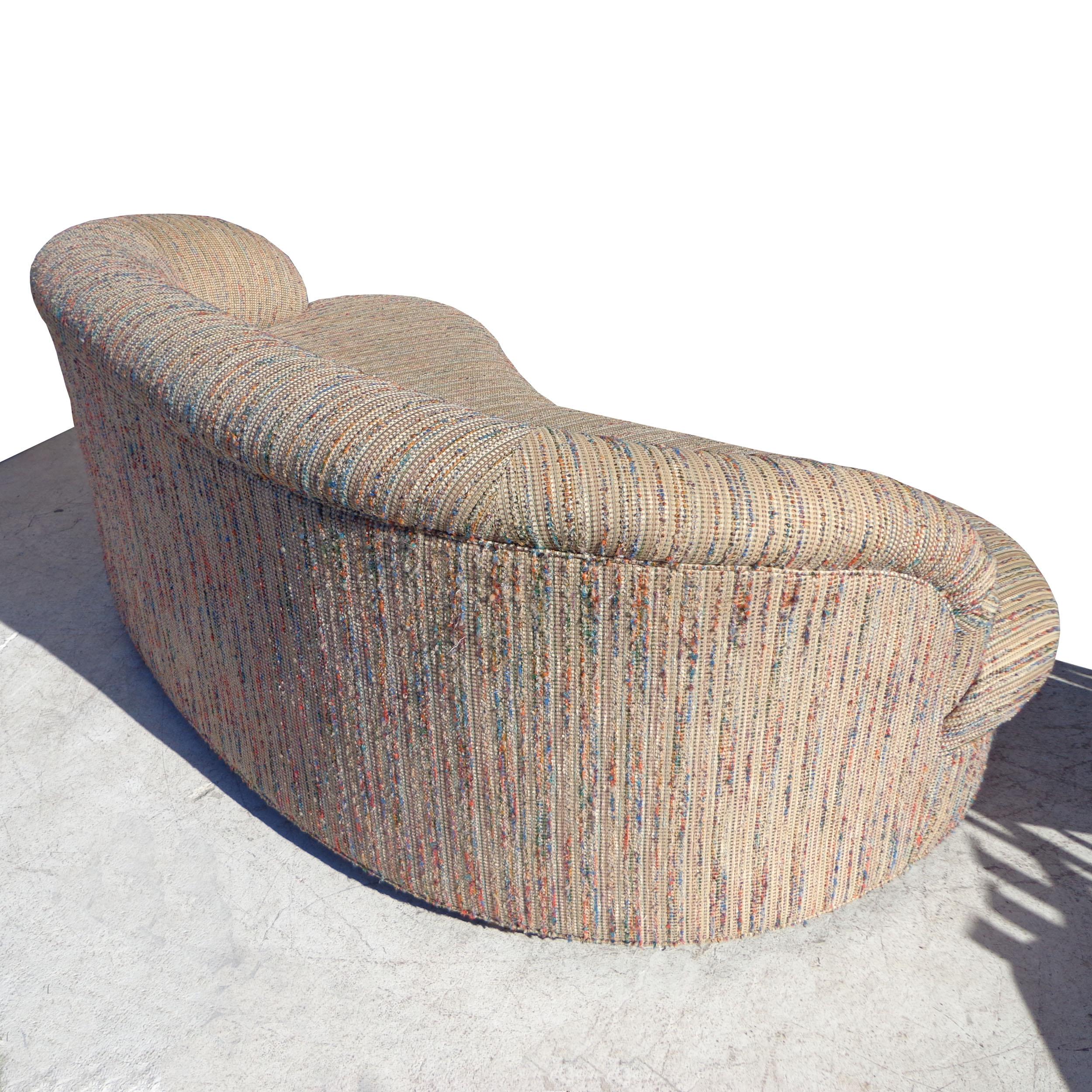 83? Modern curved kidney shaped sofa 

Kidney-shaped sofa with a sculptural design. Arched low-profile back. Upholstered in a textured cotton blend.


