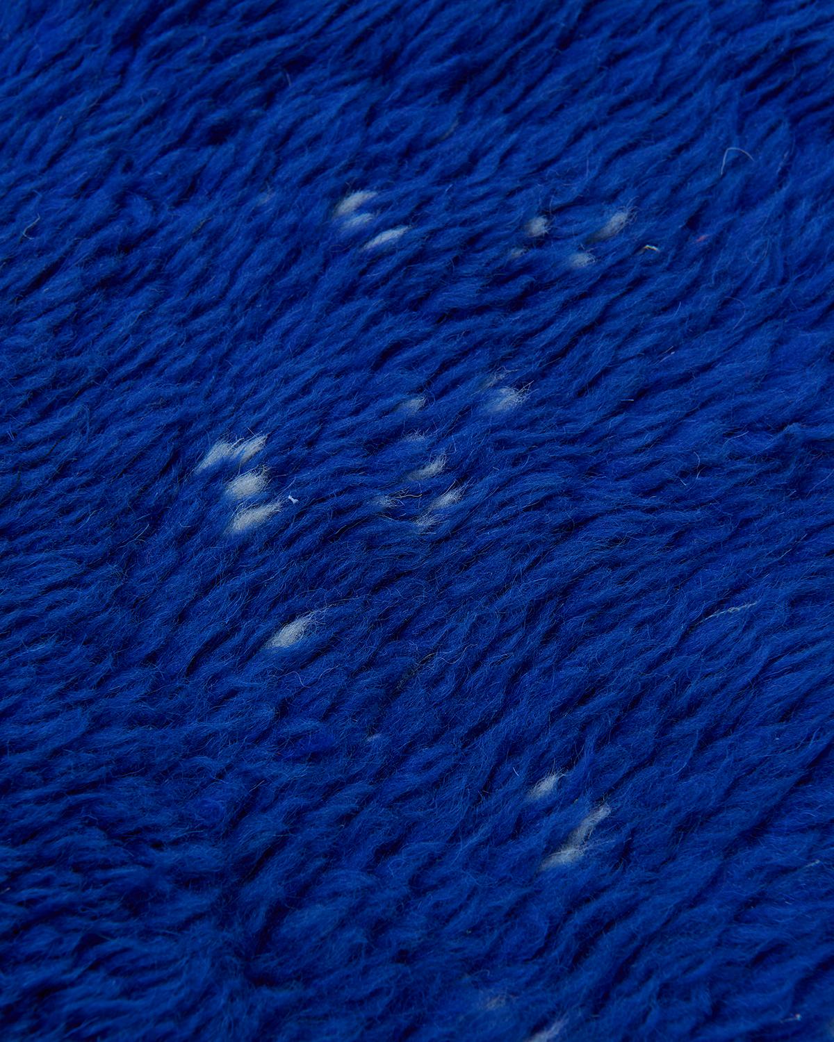 The Marilla rug is an extraordinary example of Beni M’rirt craftsmanship, handwoven in Morocco using 100% natural sheep’s wool. Rich shades of blue and green flow together in this luxurious piece, creating a serene, jewel-toned landscape underfoot.