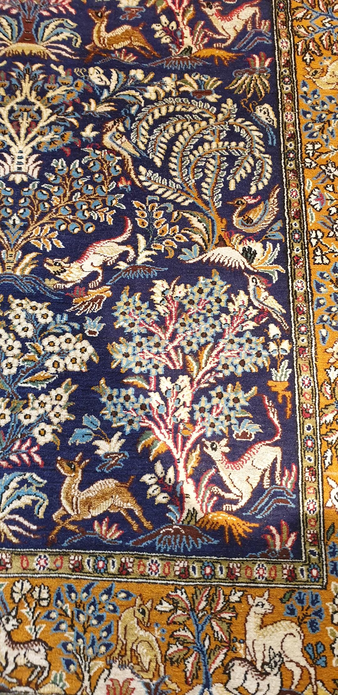830 - Very nice fine carpet. middle of the 20th century with a very beautiful drawing of animals and flowers, and pretty colors in the colors red, blue, green and yellow on beige ground, entirely hand-knotted with wool velvet on cotton foundation.