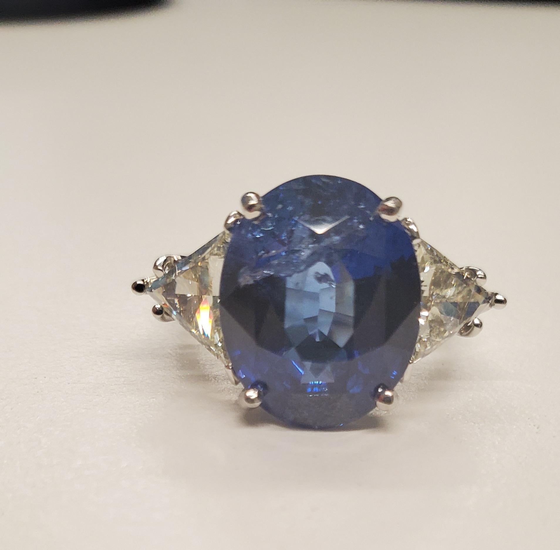 Oval Cut 8.30 Carat Oval Blue Sapphire & Trillion Cut Diamond Ring in Platinum