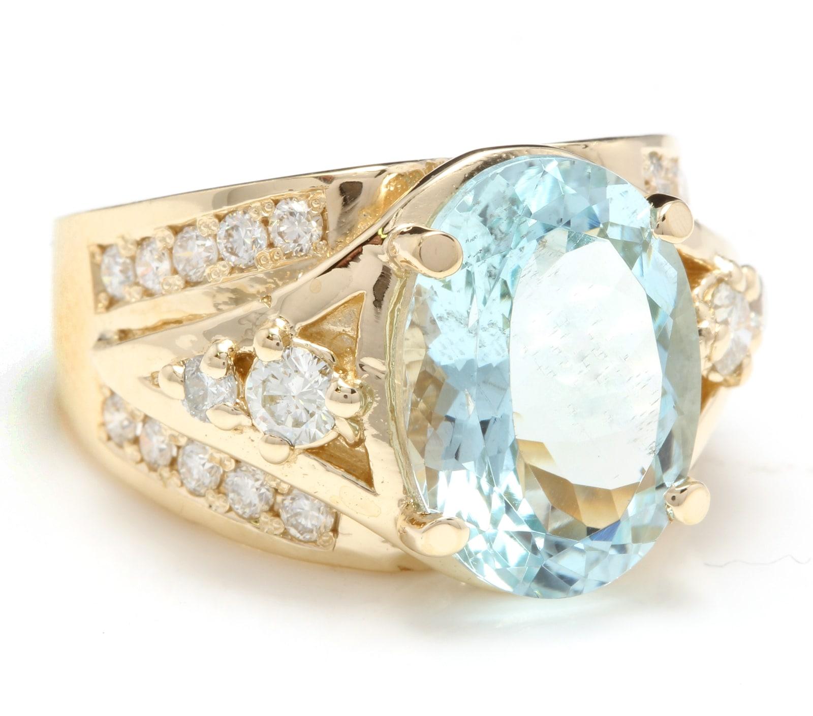 8.30 Carats Exquisite Natural Aquamarine and Diamond 18K Solid Yellow Gold Ring

Suggested Replacement Value: 8,000.00

Total Natural Aquamarine Weight is: Approx. 7.00 Carats 

Aquamarine Measures: Approx. 14.12 x 10.80mm

Natural Round Diamonds
