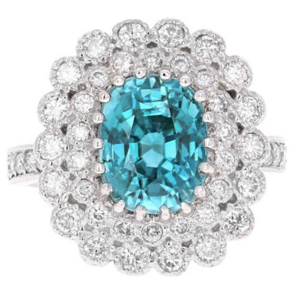 8.30 Carats Natural Very Nice Looking Blue Zircon and Diamond 14K Solid White Gold Ring

Suggested Replacement Value: $8,500.00

Total Natural Oval Cut Blue Zircon Weight is: Approx. 7.00 Carats 

Natural Round Diamonds Weight: 1.30 Carats (color