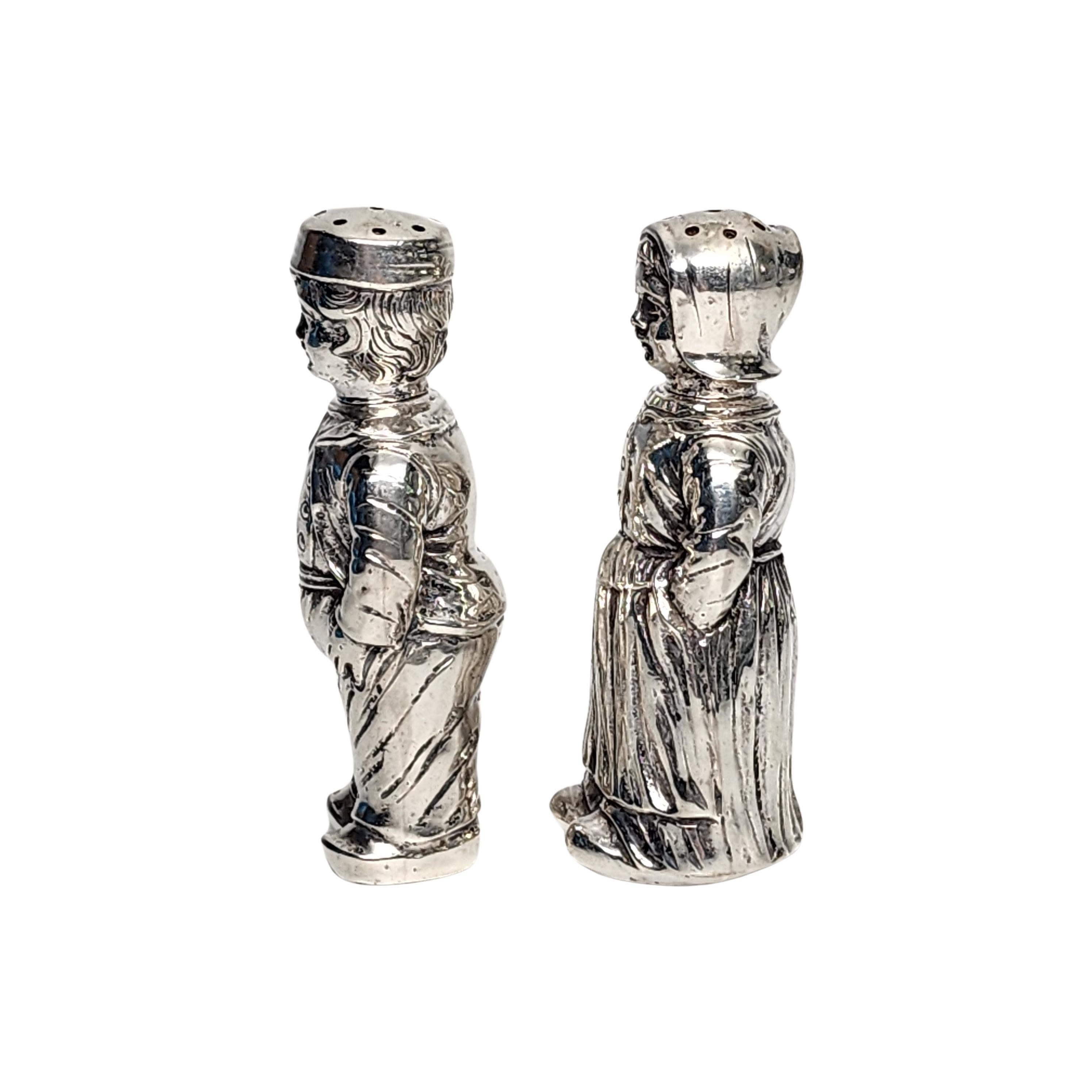 Vintage 830 silver figural Dutch boy and girl salt and pepper shakers.

A pair of salt and pepper shakers, 1 boy and 1 girl in highly detailed traditional clothing. Each head twists off to fill, with notch and tab closures.

Measures approx 3 1/8