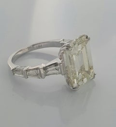 8.31 Carat Emerald cut White Diamond And Baguette Ring In 18K Gold.