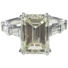 8.31 Carat Emerald cut White Diamond And Baguette Ring In 18K Gold. 
