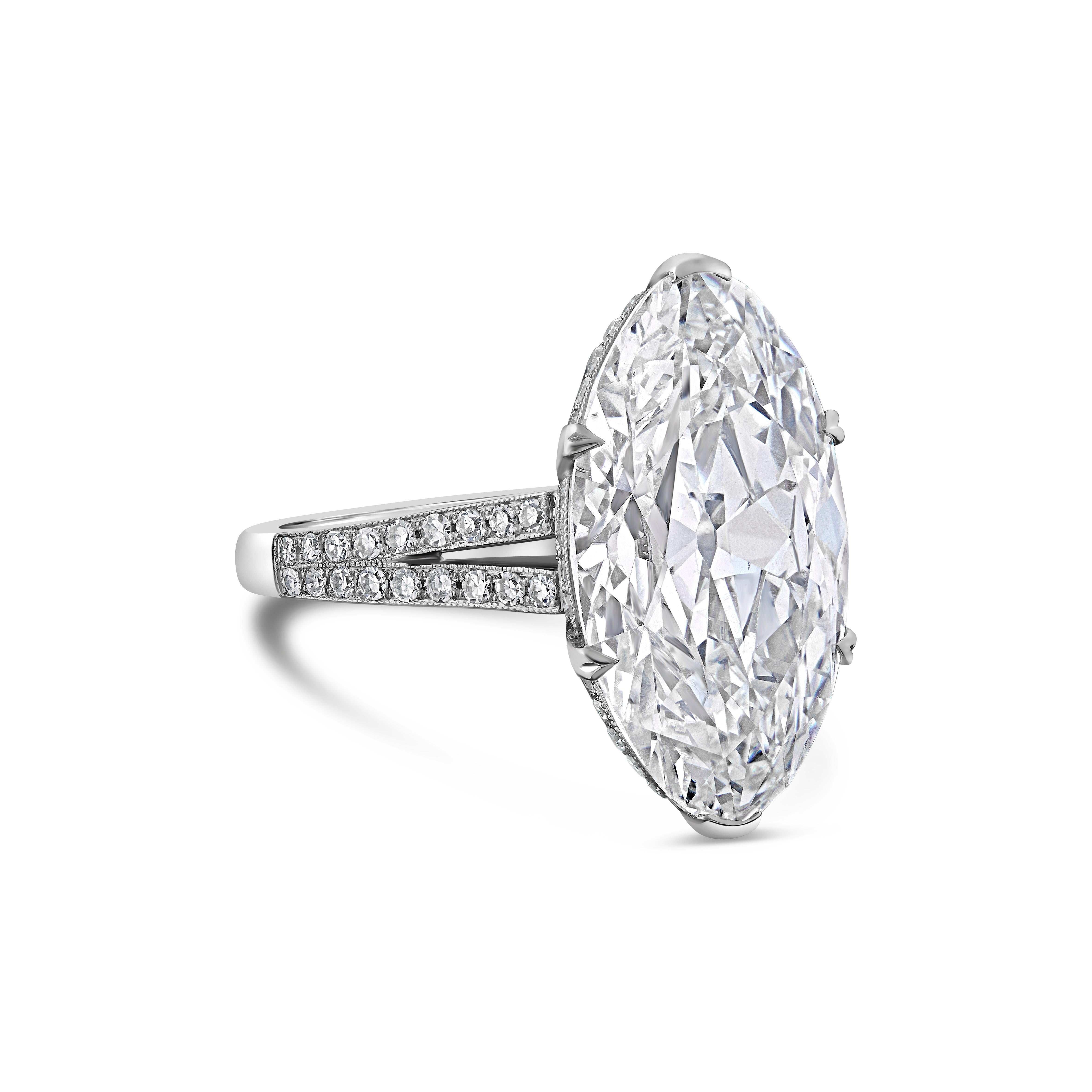 A sensational diamond ring by Hancocks set with a beautiful antique moval shaped brilliant cut diamond weighing 8.31cts and of H colour and SI1 clarity claw set to an open gallery embellished with single cut diamonds between split shoulders with