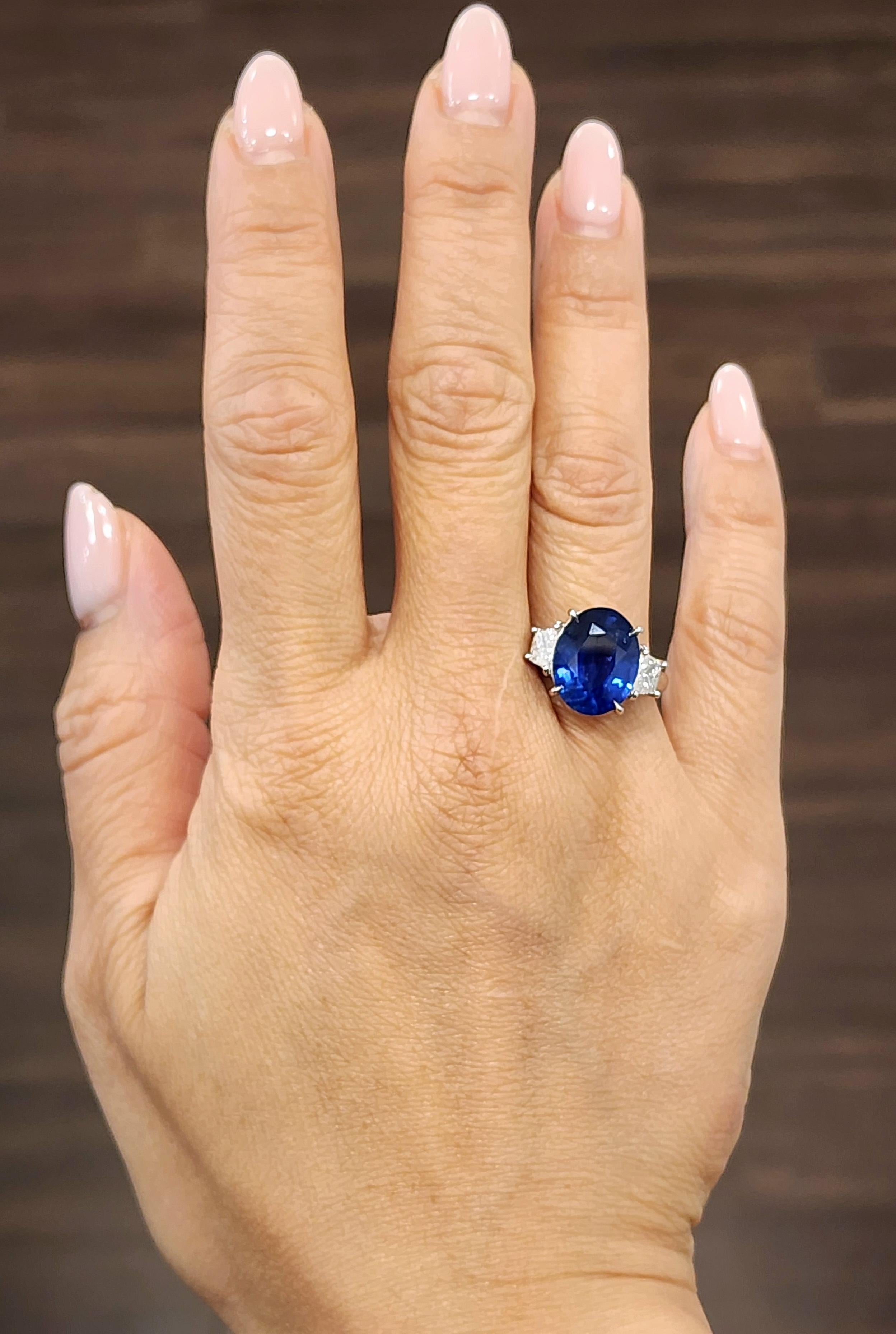 This stunning GIA certified natural sapphire and diamond ring is sure to turn heads. Mounted in platinum, the 2 side traps are F/G in color and VS in clarity. Such a gorgeous ring to adorn anyone's finger.