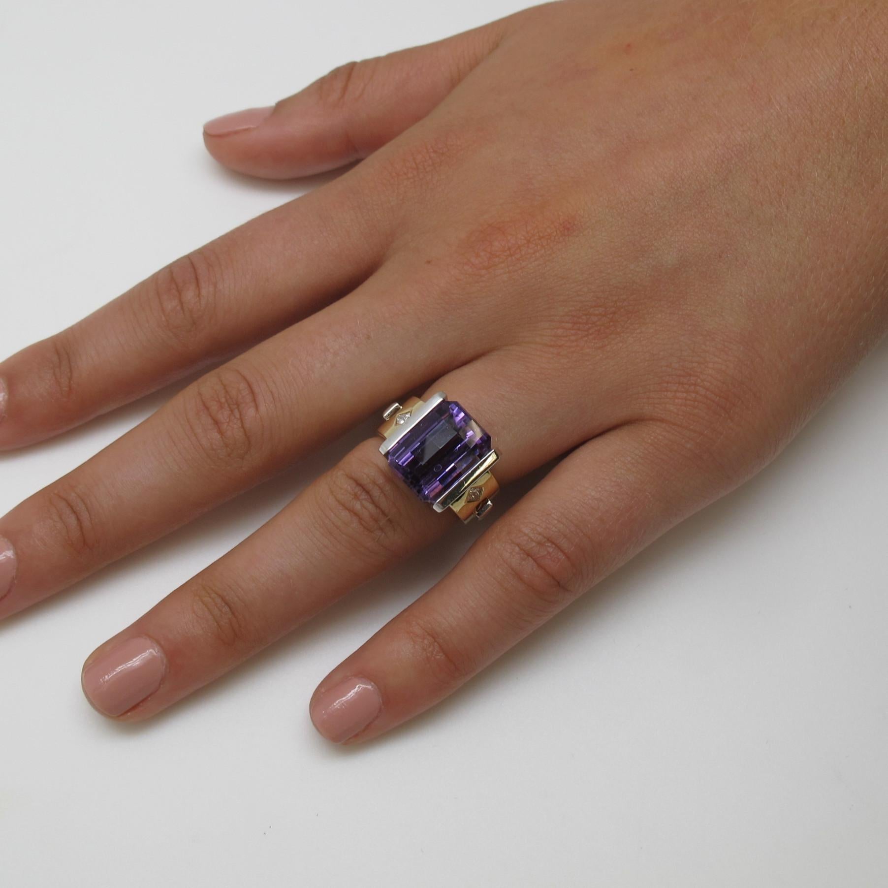 This unique ring is undeniably striking. The combination of both 18K white and yellow gold and the distinct detailing  along the sides makes this ring truly one of a kind. The emerald cut, checkerboard amethyst measures 13.5x10.5 (8.33 carats), two