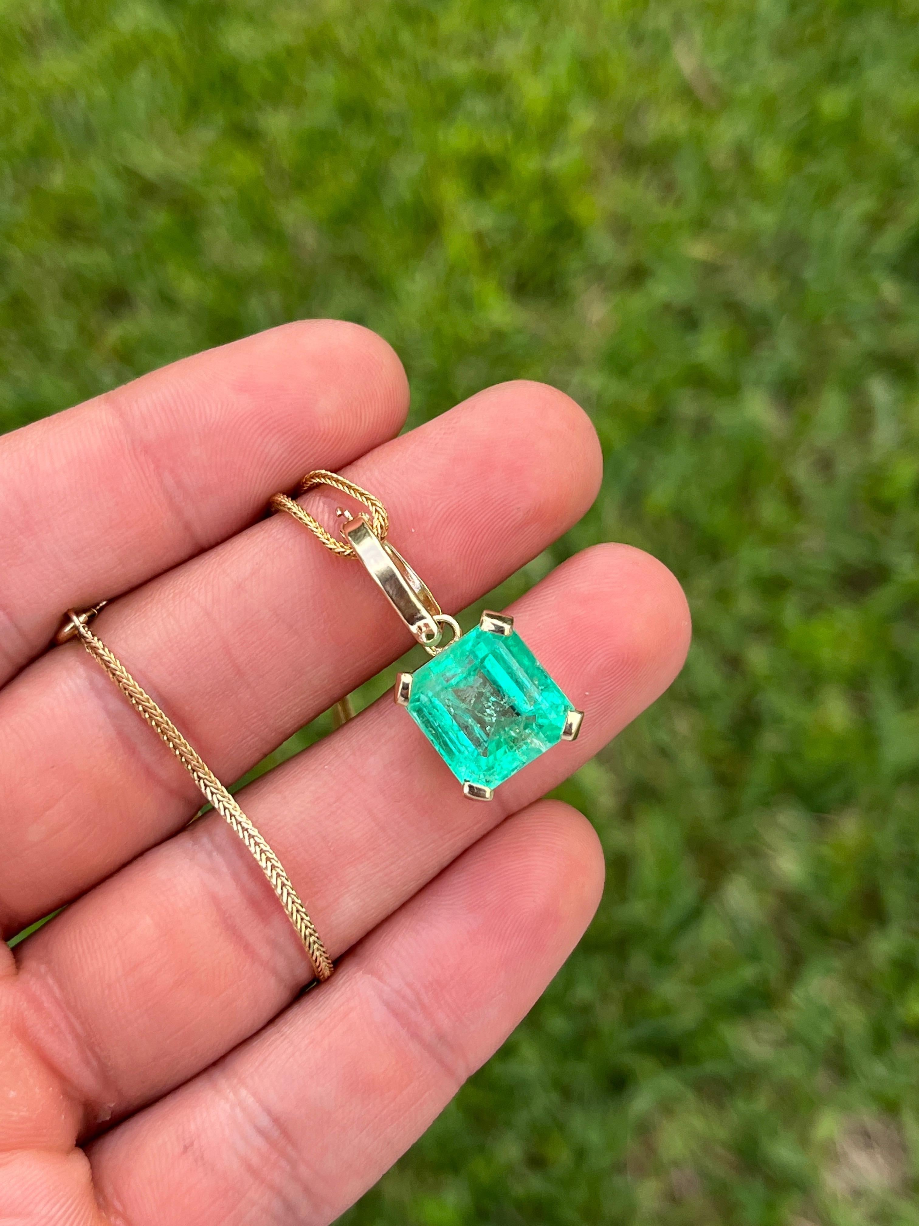 8.34-carat Colombian Emerald solitaire pendant set in 14k gold basket 4-prong mounting. Comes with a detachable bail that fits any chain up to 6mm. Original bail fits 1mm-1.5mm chain. 

The emerald center stone features excellent color, luster, and