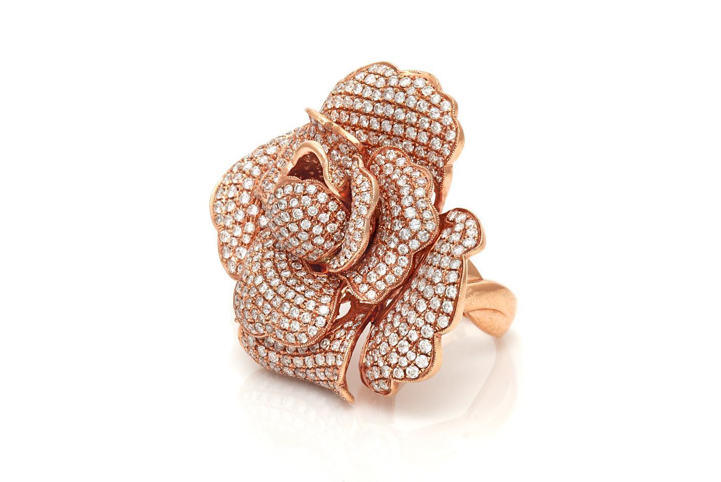 Finely crafted in 14k rose gold with pave-set Round Brilliant cut Diamonds weighing a total of 8.34 carats.
Can be worn as a ring or pendant.
Ring size 7 3/4, resizable
2 inch diameter