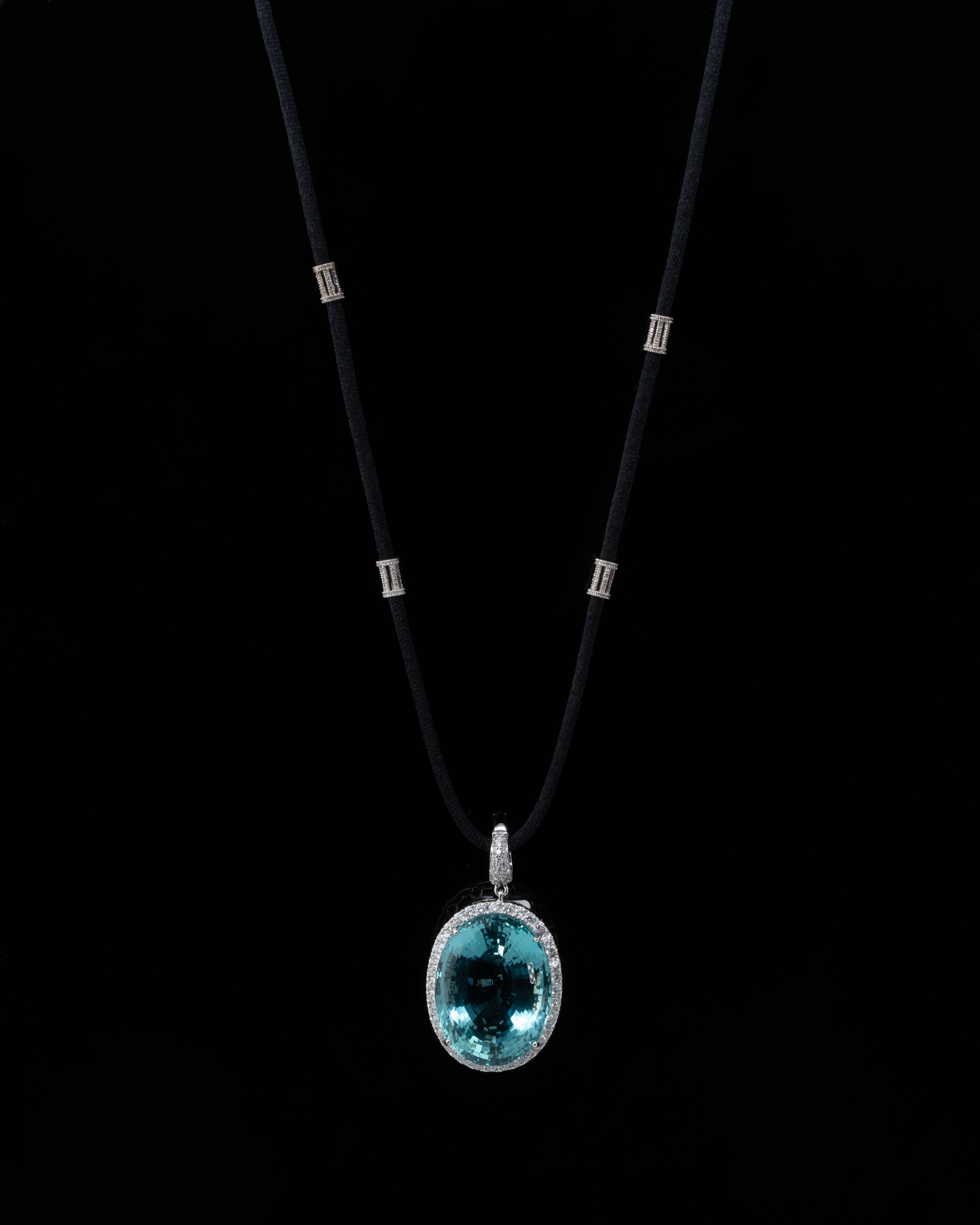 Make a statement when wearing this stunning 83.46ct Aquamarine and Diamond Pendant, set in 18K White Gold. This natural Aquamarine is transparent, with no inclusions at all with an ideal colour and great cut, making it a valuable and collector item.