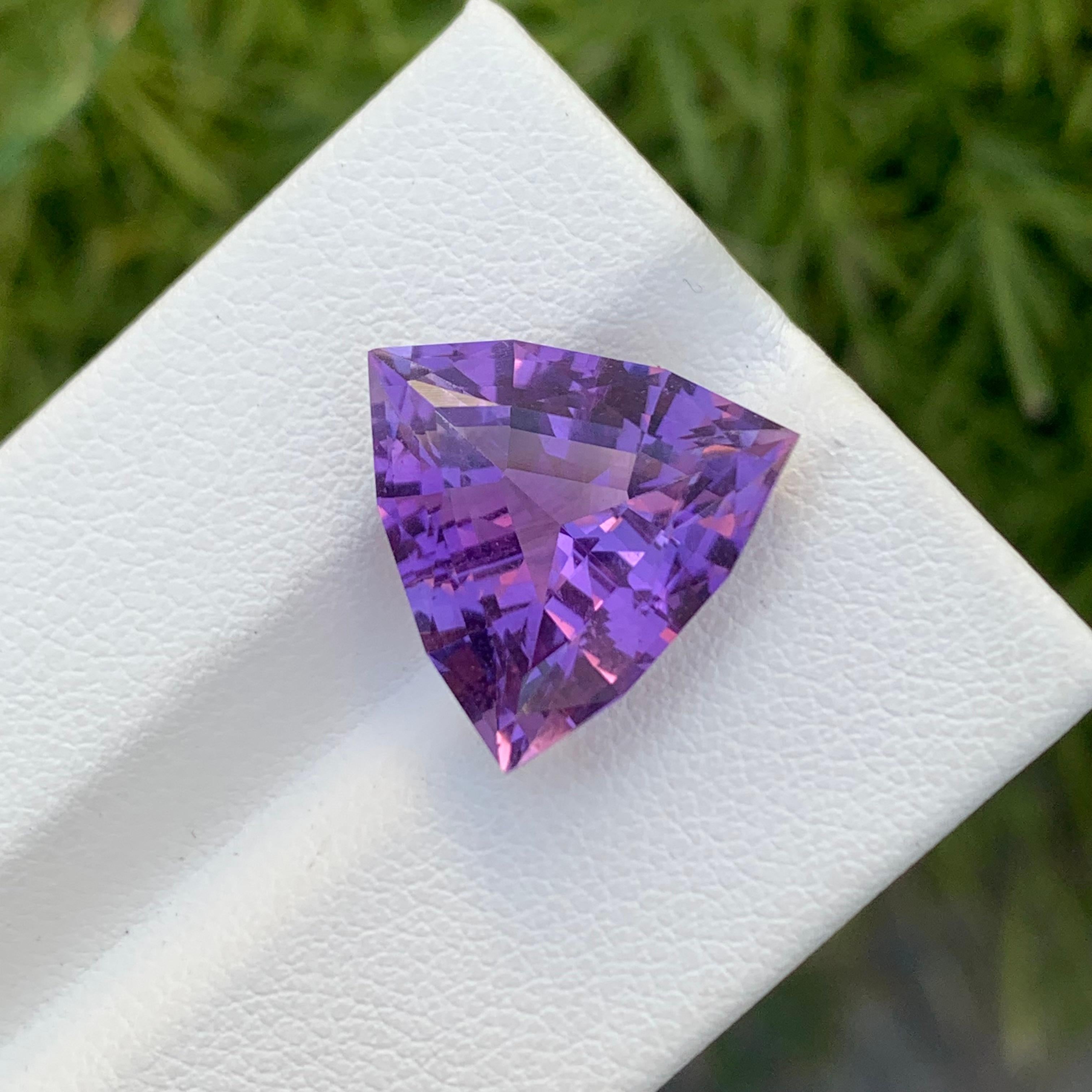 Loose Amethyst
Weight: 8.35 Carats
Dimension: 14.6 x 14.6 x 8.5 Mm
Colour: Purple
Origin: Brazil
Treatment: Non
Certificate: On Demand
Shape: Trillion 

Amethyst, a stunning variety of quartz known for its mesmerizing purple hue, has captivated