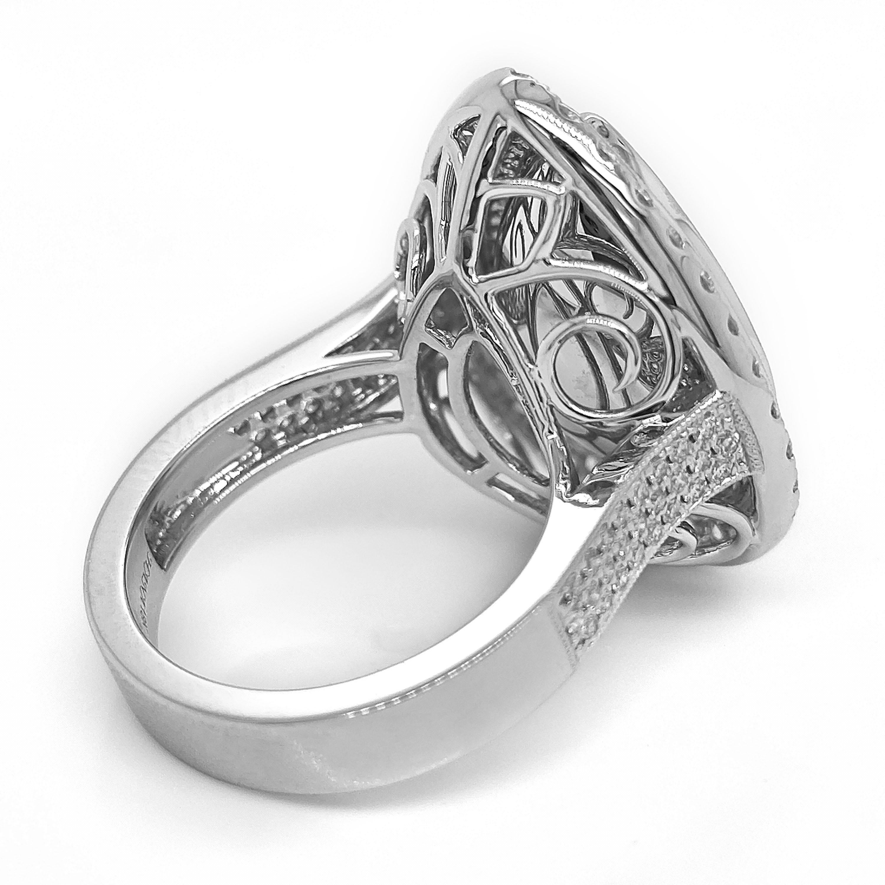 1 Sapphire Gemstone: 7.09 Carats
102 White Round Diamonds: 0.51 Carats
32 White Round Diamonds: 0.75 Carats
Metal: 18K White Gold, 11.90 Grams
