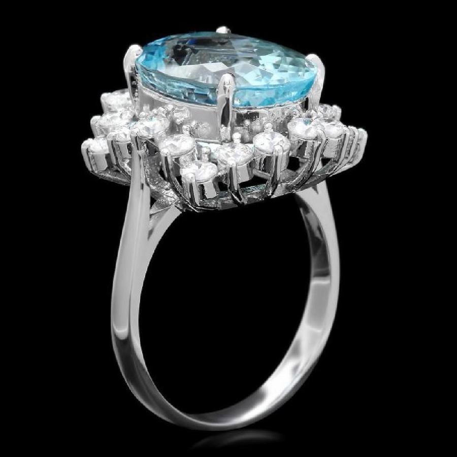 7.85 Carats Natural Aquamarine and Diamond 14K Solid White Gold Ring

Total Natural Oval Cut Aquamarine Weights: Approx. 6.50 Carats

Aquamarine Measures: Approx. 14.00 x 10.00mm

Aquamarine Treatment: Heating

Natural Round Diamonds Weight: Approx.