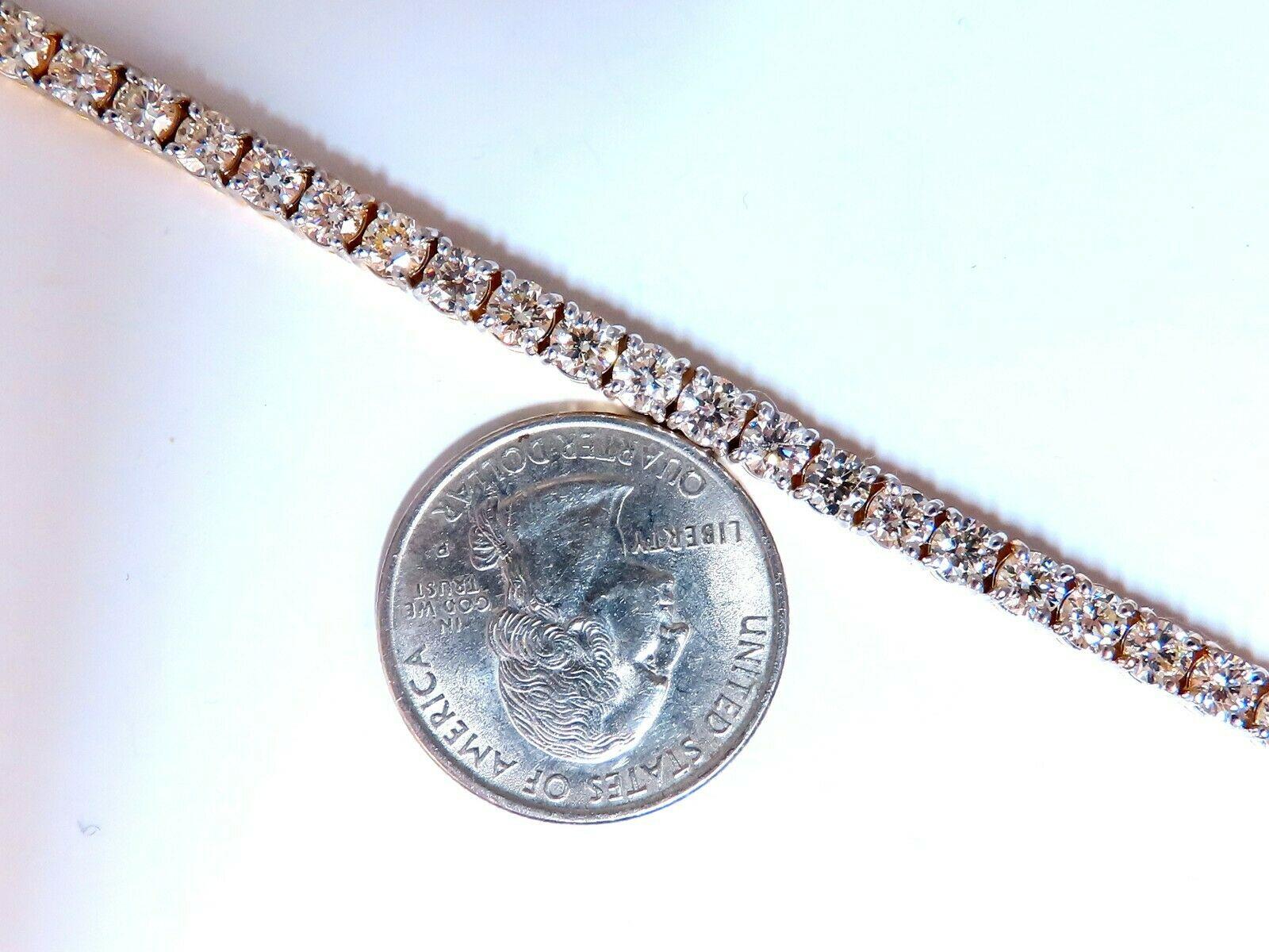 8,35ct. Diamants naturels Bracelet à maillons de tennis.

Rounds, full cut.

J couleur

Clarté Vs-2.

Or jaune 14kt. 

16,5 grammes.

4,2 mm de large

7 pouces de long (longueur portable)

Fermoir de sécurité.

38 000 $ Le certificat d'évaluation