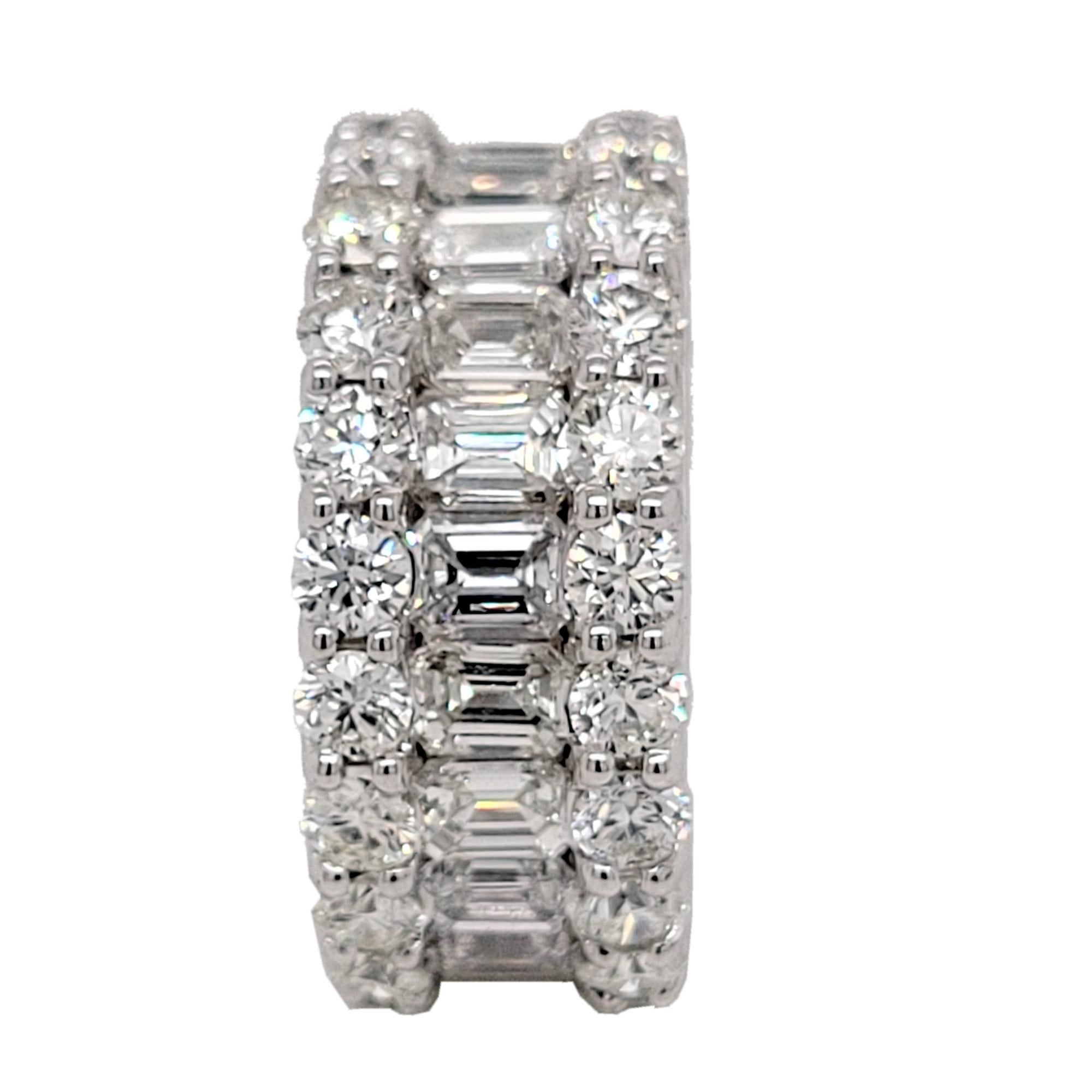 This beautiful Eternity Ring is made in 18K White Gold showcasing 22 perfectly matched VS/E-F Emerald Cut and 44 Round Brilliant Diamonds. Emerald Cut diamonds are channel set in the center with Round diamonds set in Shared Prong Mode on the