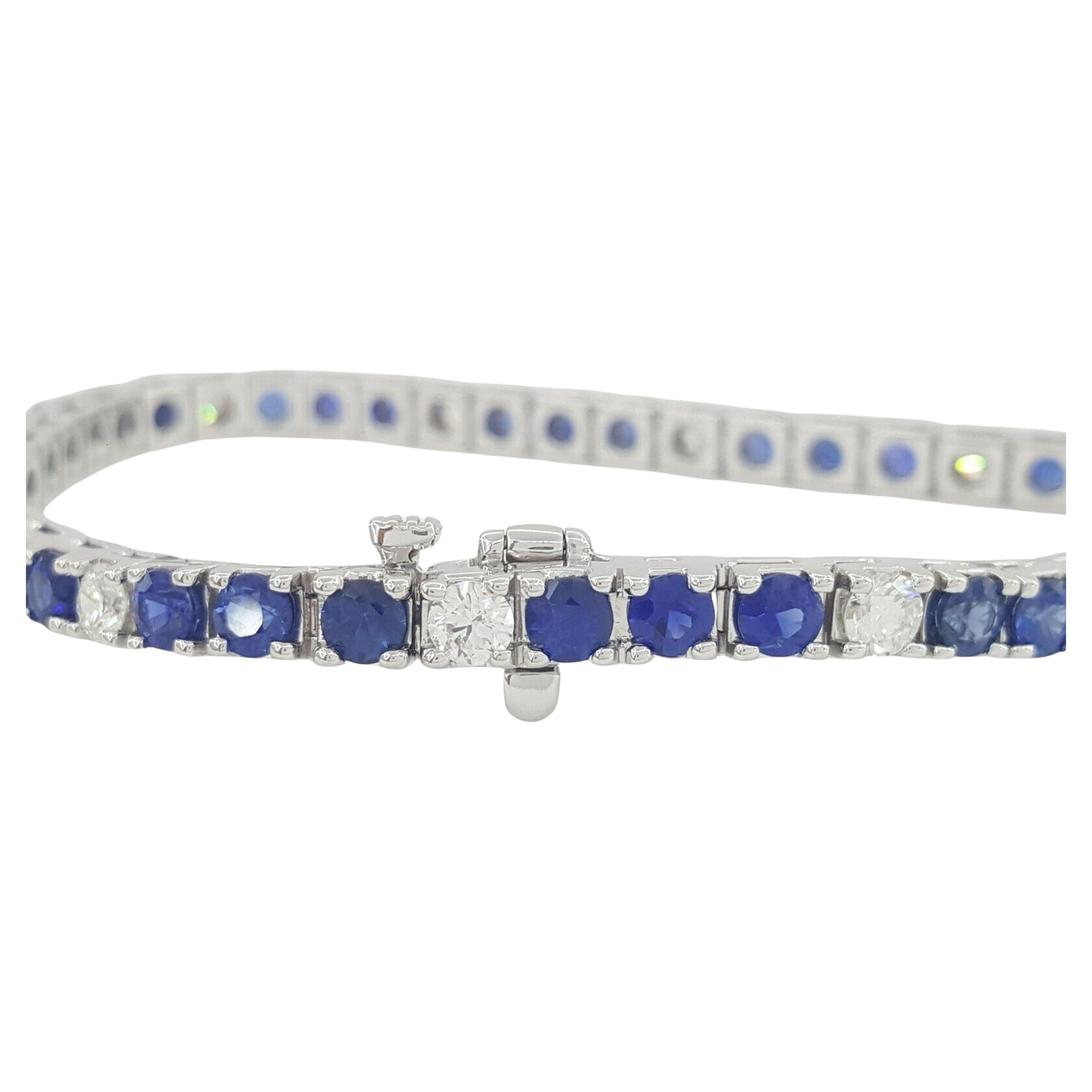 An exquisite tennis bracelet composed by approximately 8.30 carats of Diamond & Sapphire  Tennis Bracelet. 

There are 33 Natural Round Brilliant Cut Vivid Blue Sapphires weighing Approximately 6.6 ct, Vivid blue in color, VS+ in clarity
