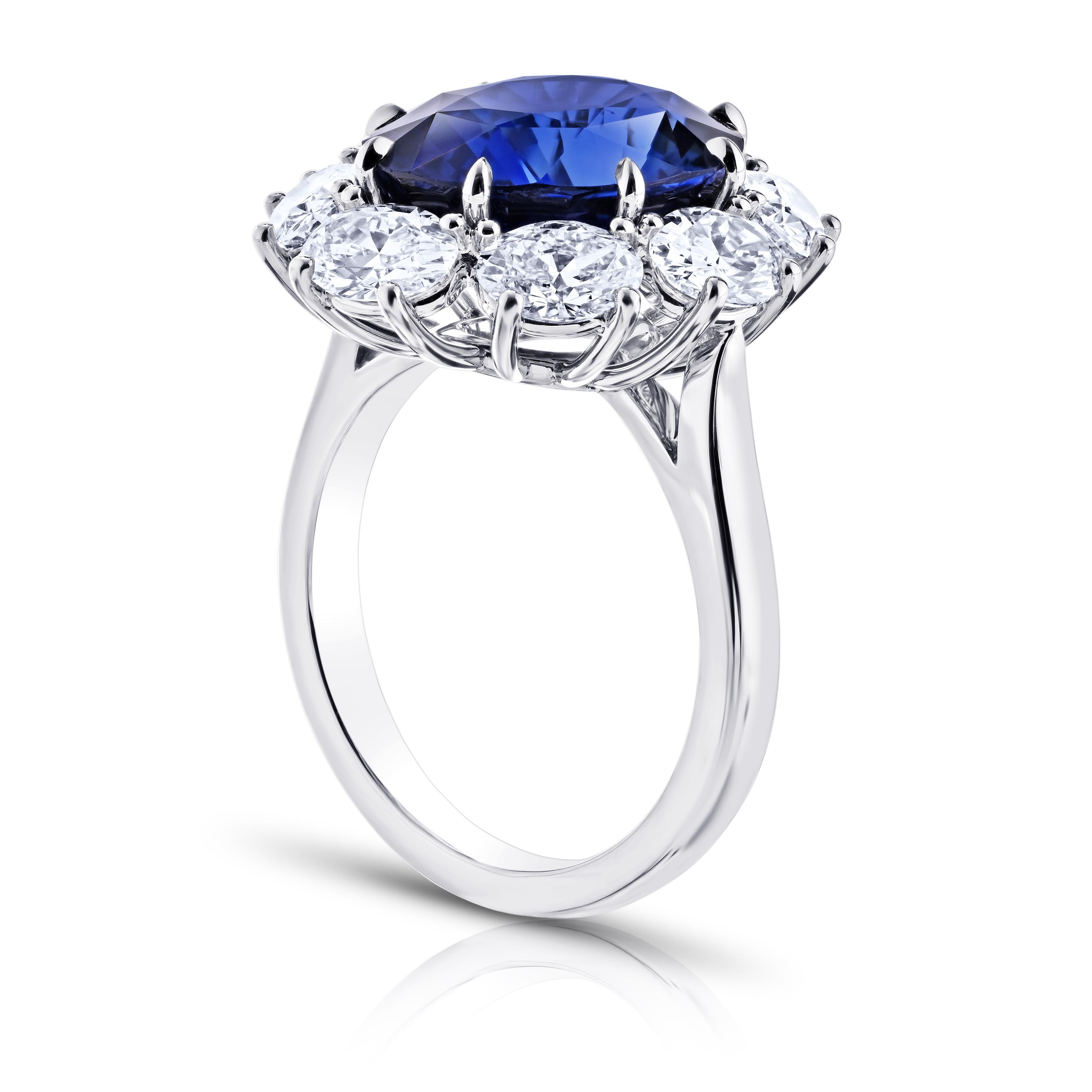 8.37 carat Oval Blue Sapphire with eight Oval Diamonds 2.66 carats set in a handmade Platinum ring