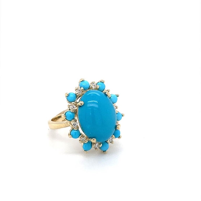 A unique stunner.....8.38 Carat Turquoise Diamond 14 Karat Yellow Gold Cocktail Ring

This ring has a 7.16 Carat Oval Cut Turquoise and is surrounded by 10 Round Cut Diamonds that weigh 0.21 Carats (Clrity: SI2, Color: F) and 10 Turquoise stones