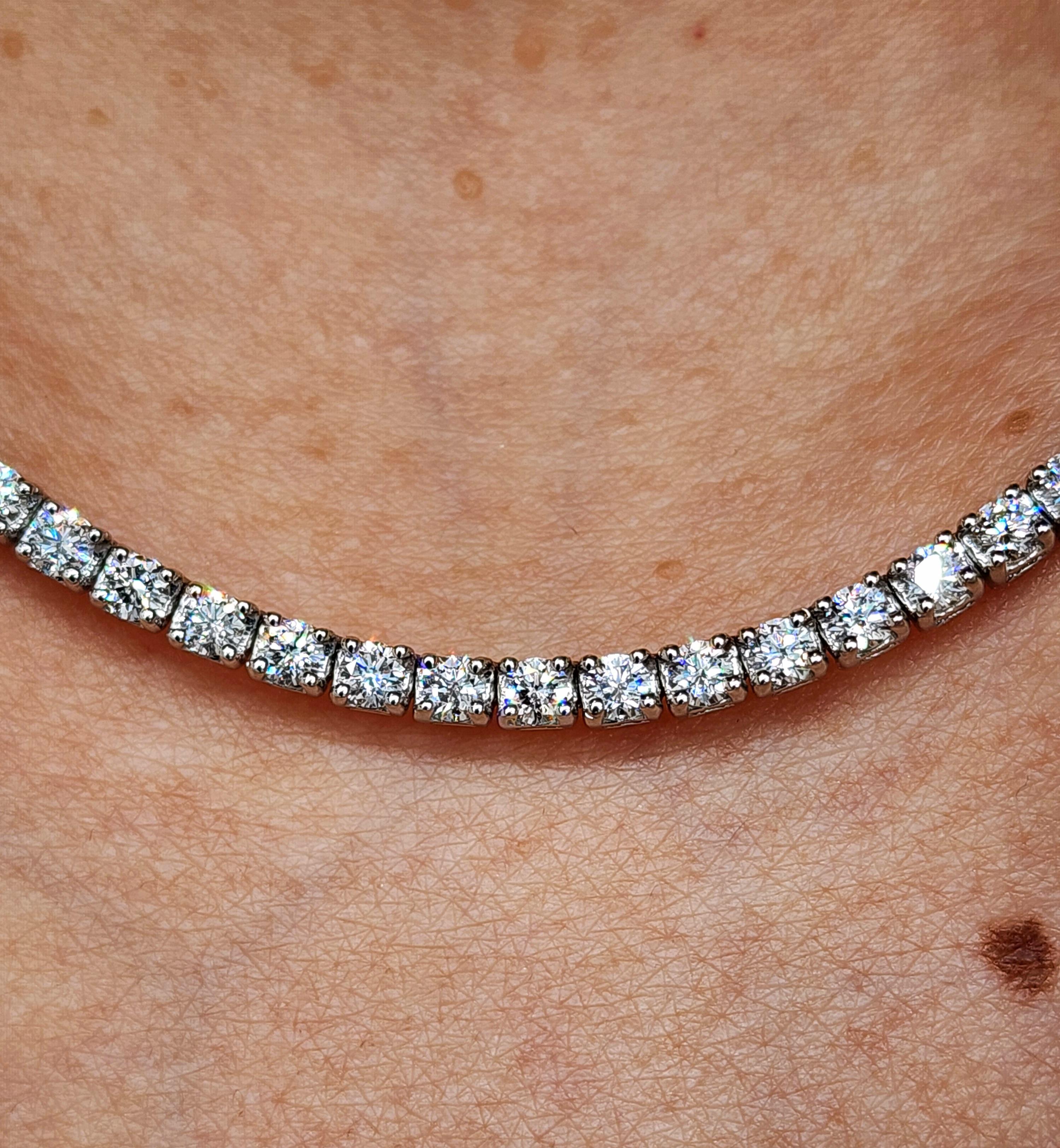 This exquisite 16-inch diamond tennis necklace is crafted to captivate. Its graceful, continuous line of meticulously set round diamonds is a testament to meticulous artistry, making this necklace a breathtaking statement piece. This dazzling
