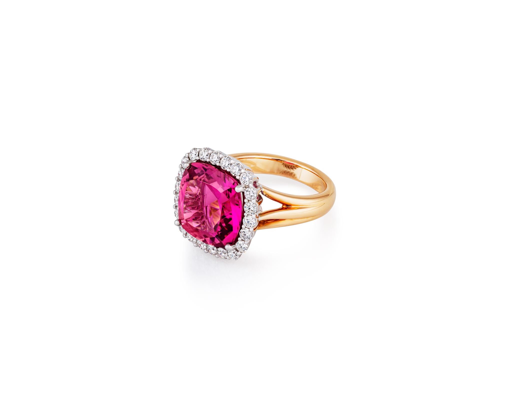 Beautiful 8.3ct Cushion Cut Pink Tourmaline surrounded by .84ct Diamonds on 14kt Yellow Gold. With the highest quality materials and vintage-inspired design, this ring will make you feel like you're a royal in the Renaissance Age. Only one